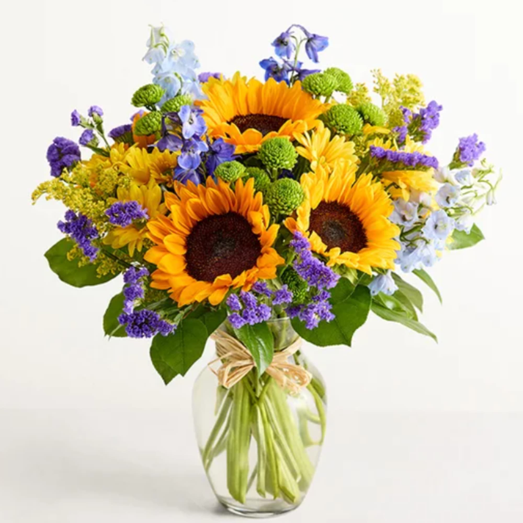 Bright, sunlit sunflowers take center stage in this summertime flower arrangement, making