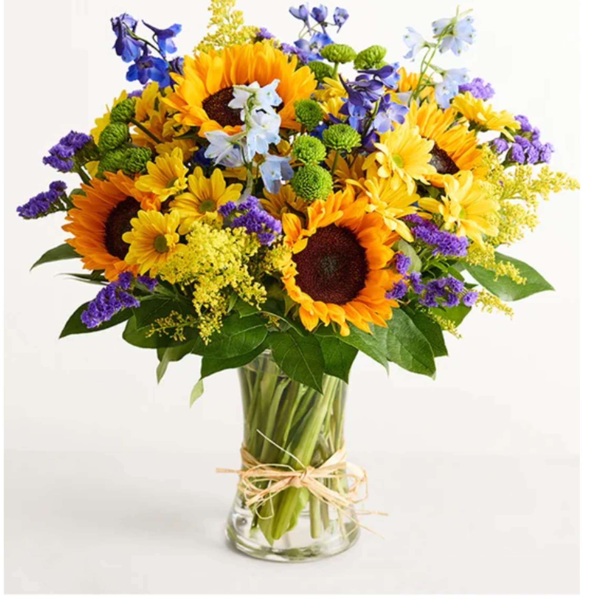 Bright, sunlit sunflowers take center stage in this summertime flower arrangement, making
