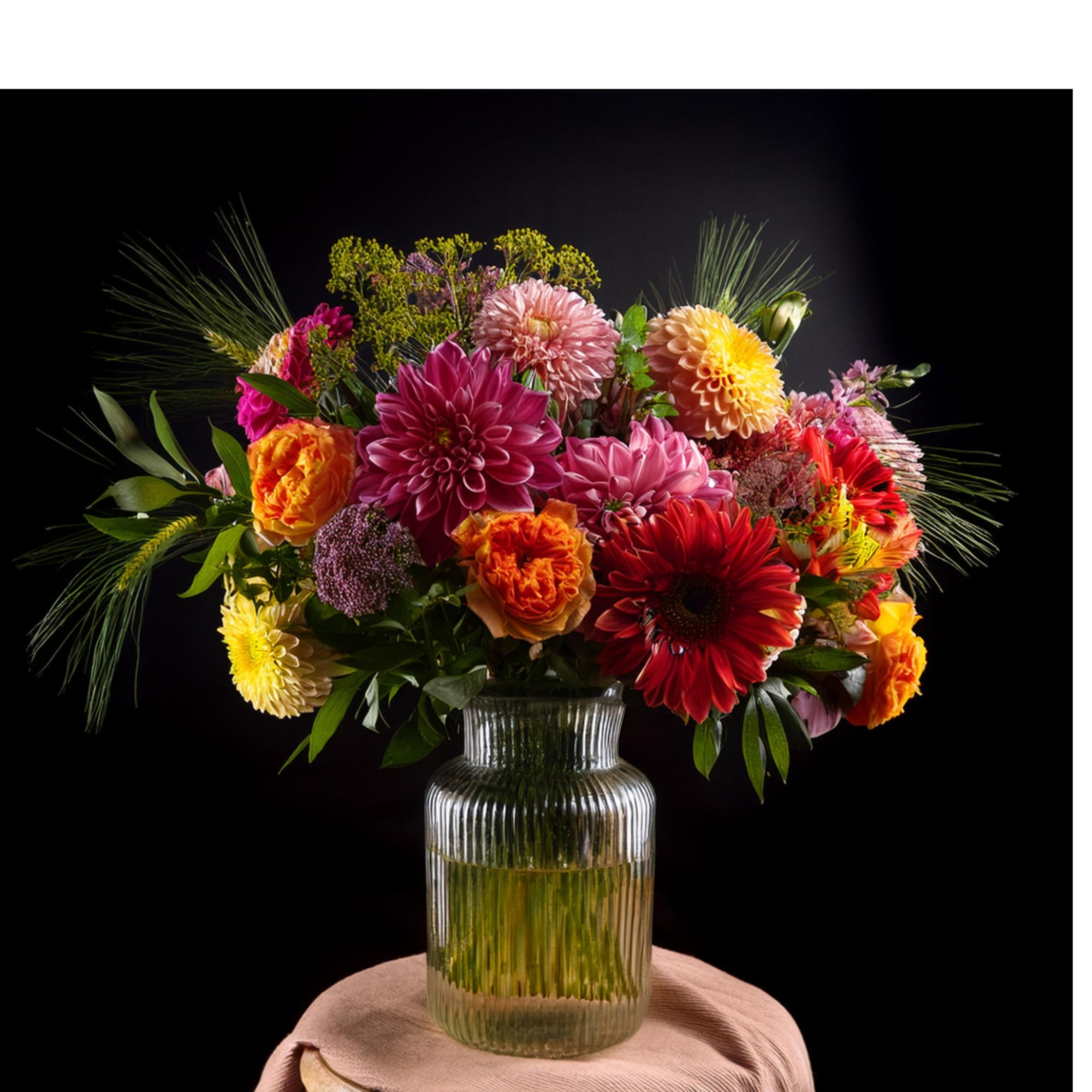 Colorful mixed bouquet in a ribbed glass vase