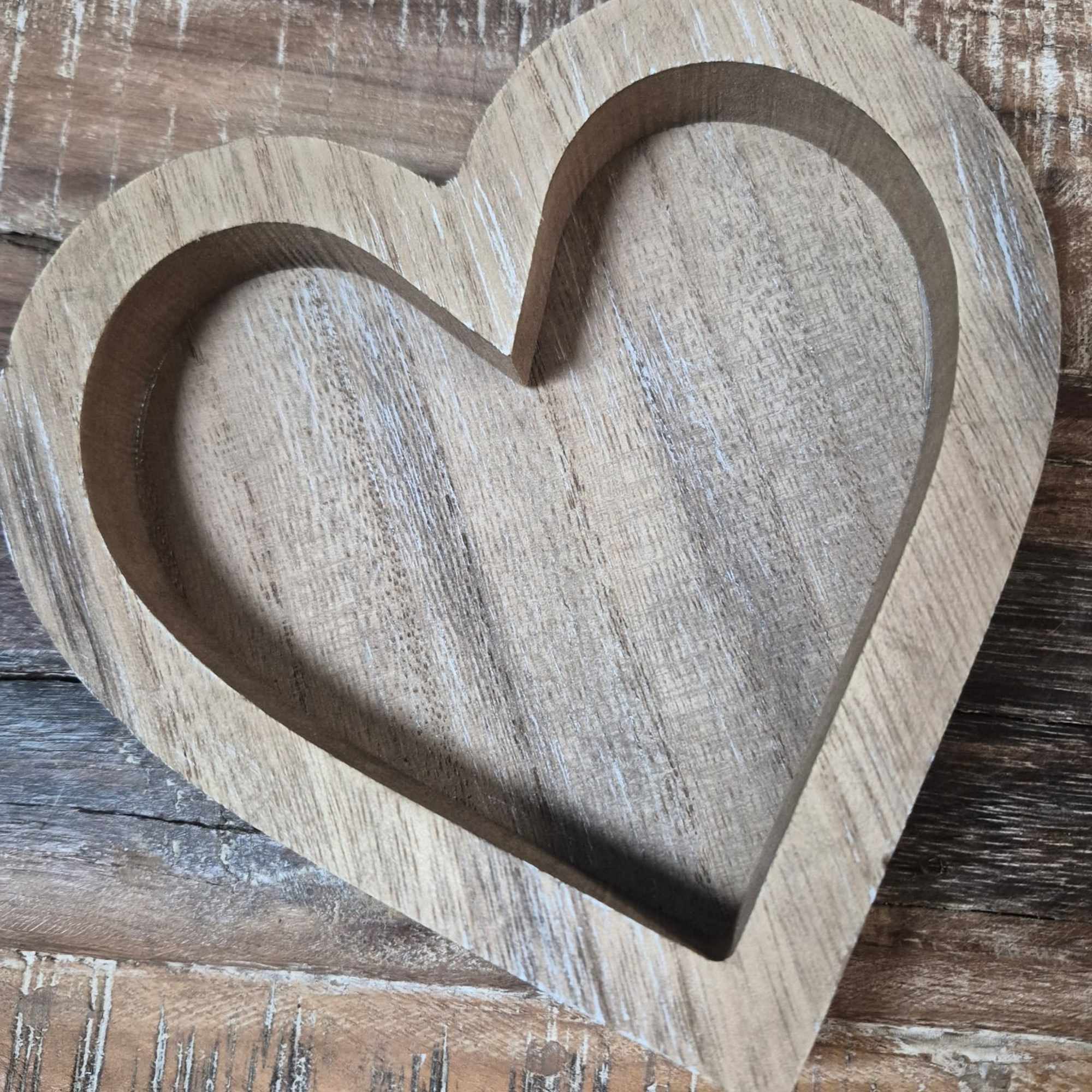 This multipurpose wooden heart can be used for decor.  Or, it