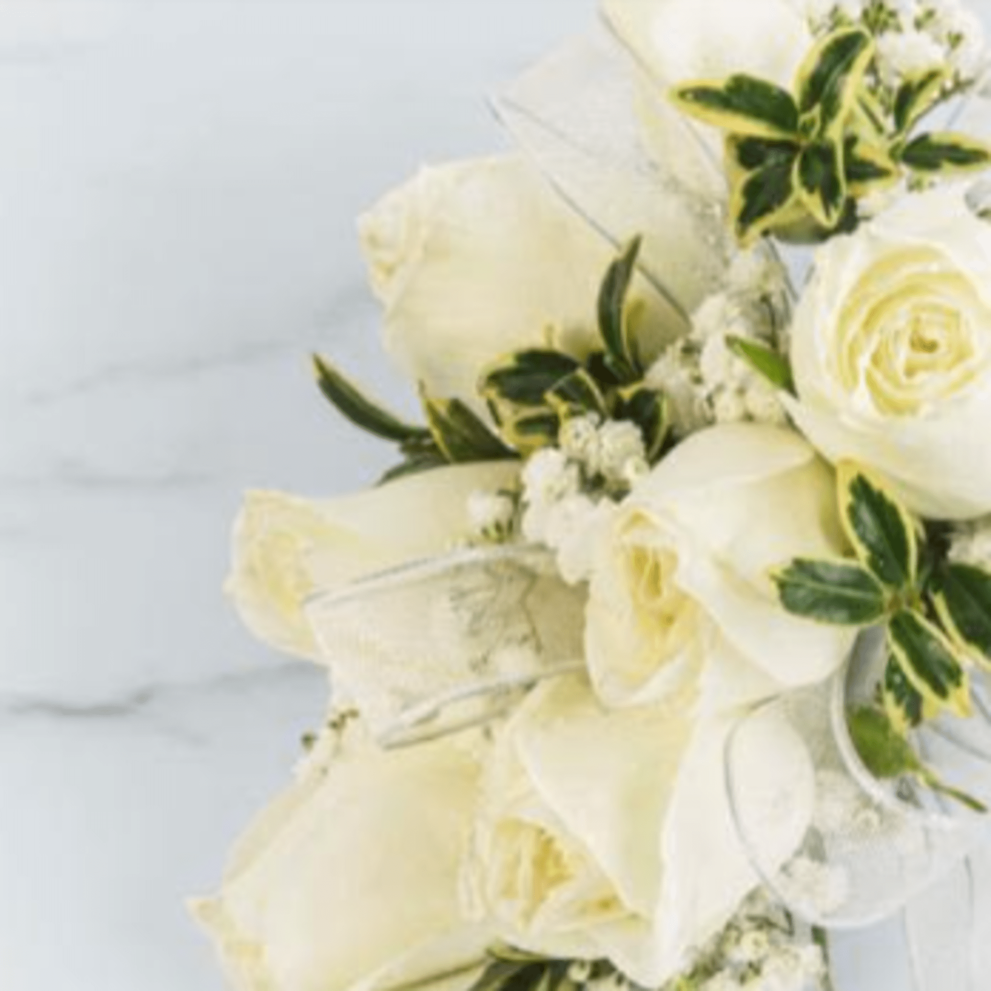 Elegant white rose prom corsage and boutonni&egrave;re set designed with fresh roses