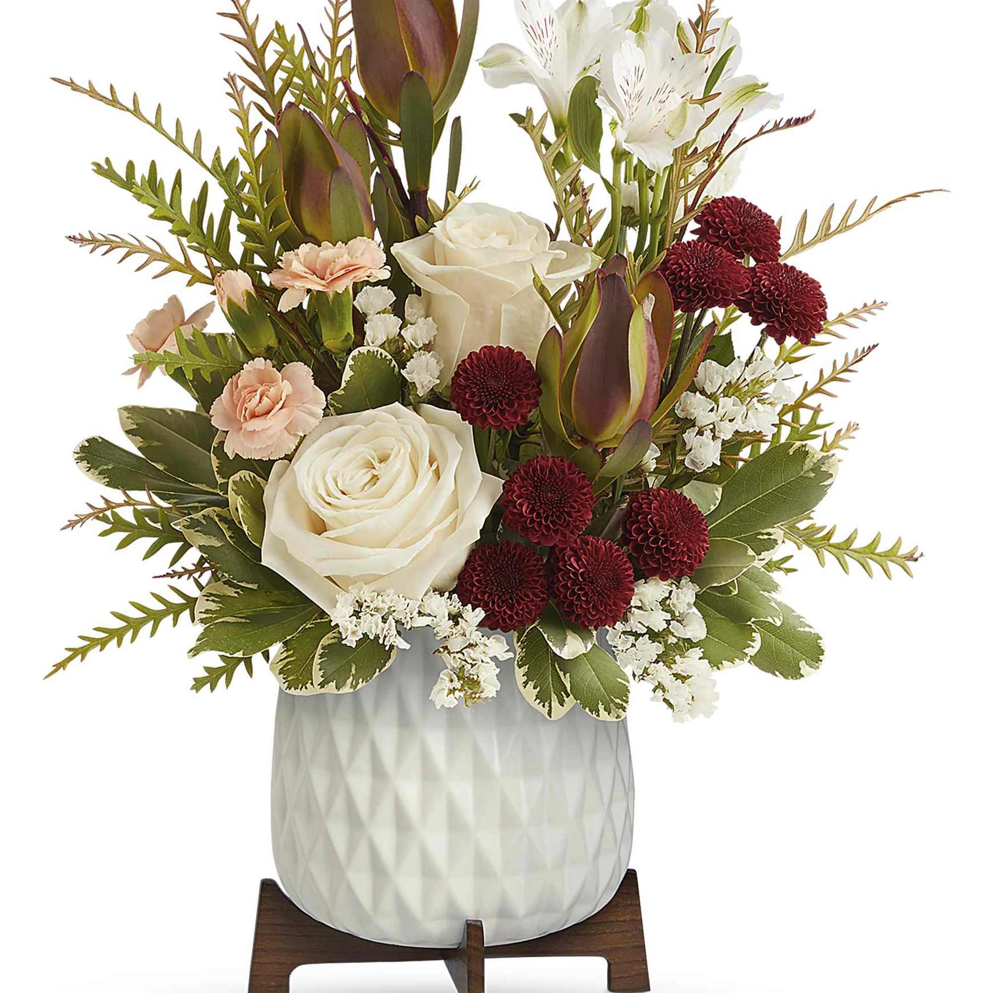 Brighten their day with Teleflora's Timeless Treasure Bouquet, showcasing radiant red and