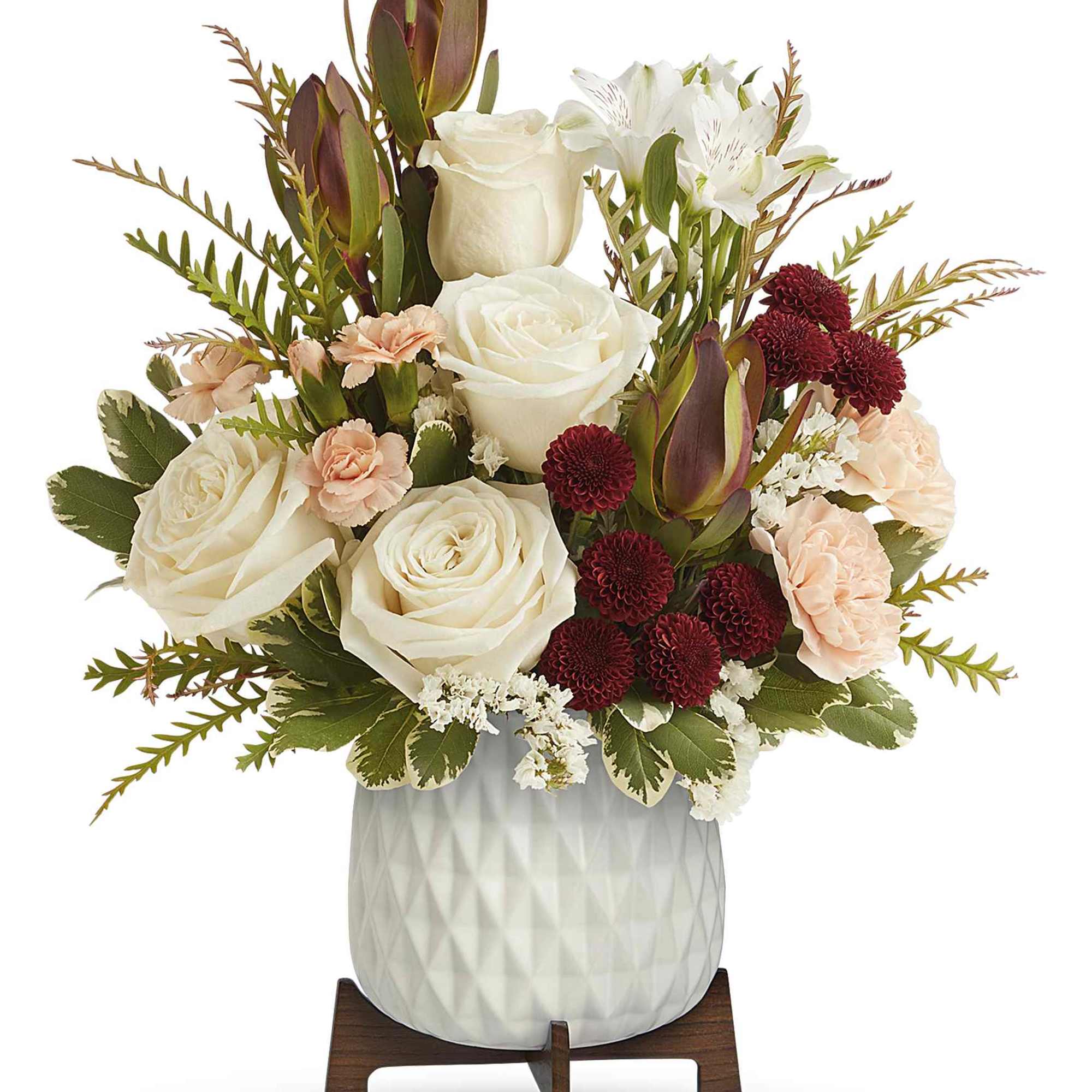 Brighten their day with Teleflora's Timeless Treasure Bouquet, showcasing radiant red and