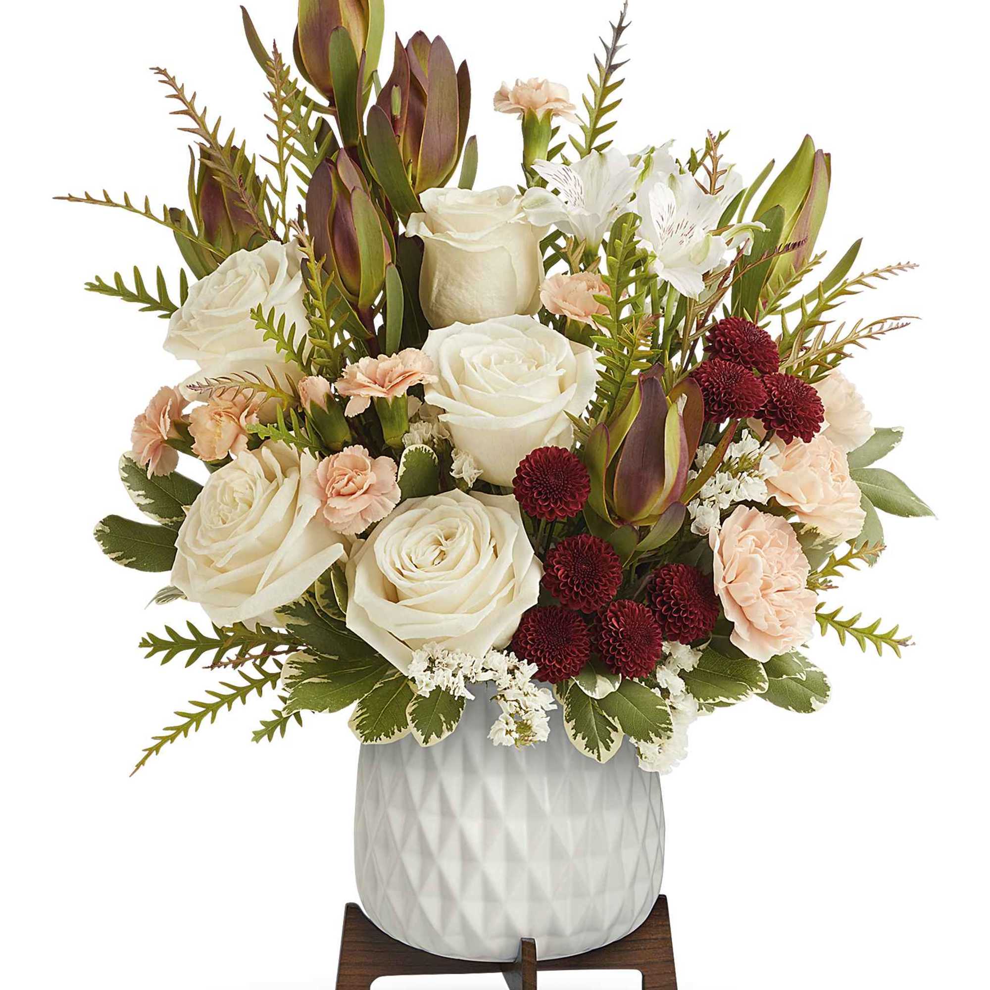 Brighten their day with Teleflora's Timeless Treasure Bouquet, showcasing radiant red and