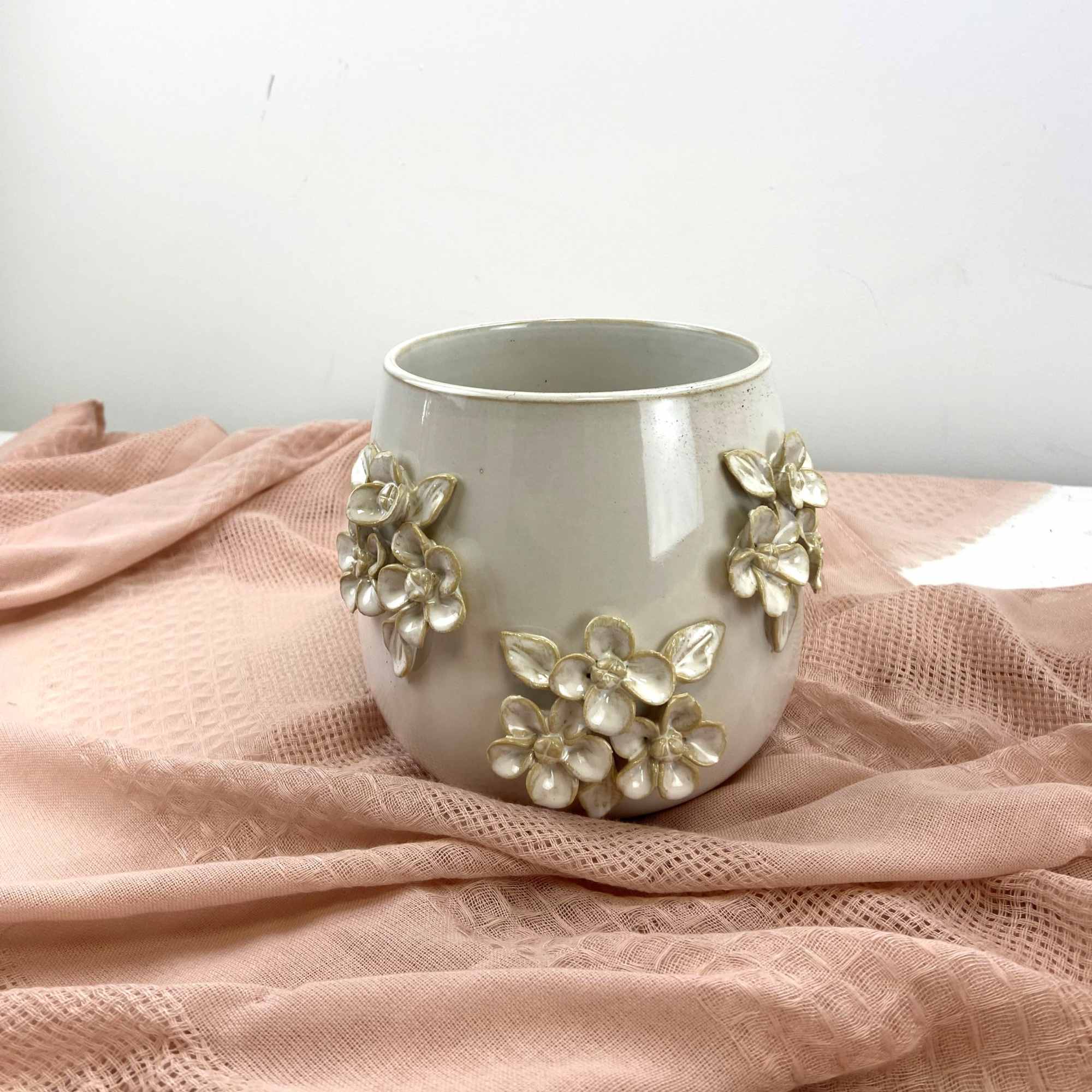 Soft peach and blush mingle with large creamy chrysanthemums to create a