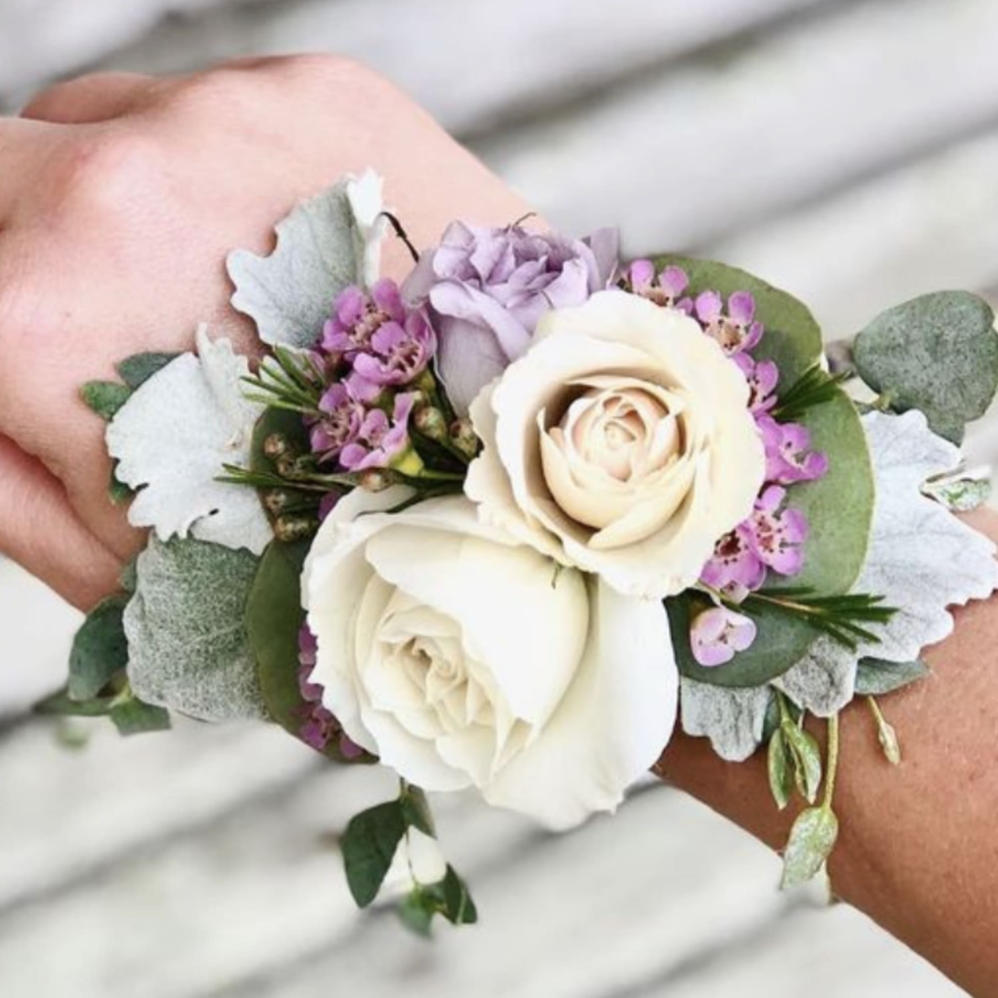 A corsage is a beautifully crafted floral arrangement worn on the wrist