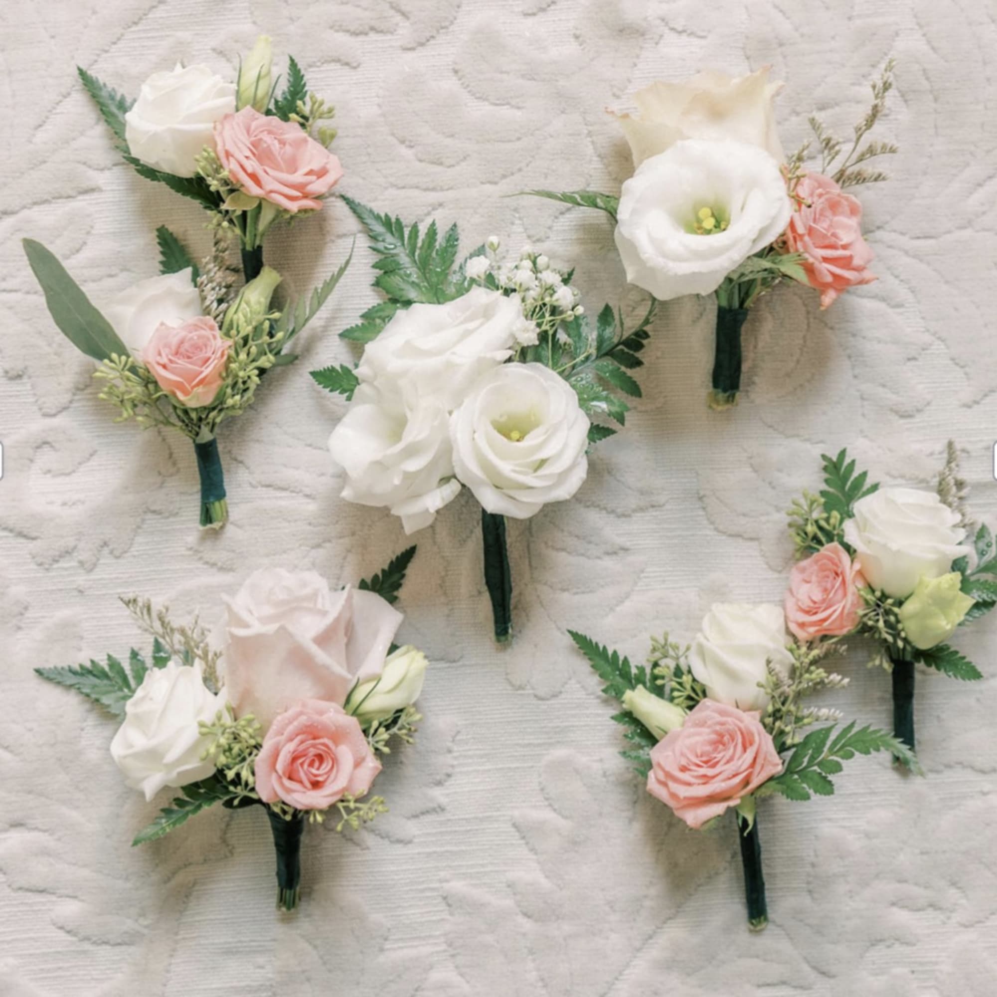 A corsage is a beautifully crafted floral arrangement worn on the wrist
