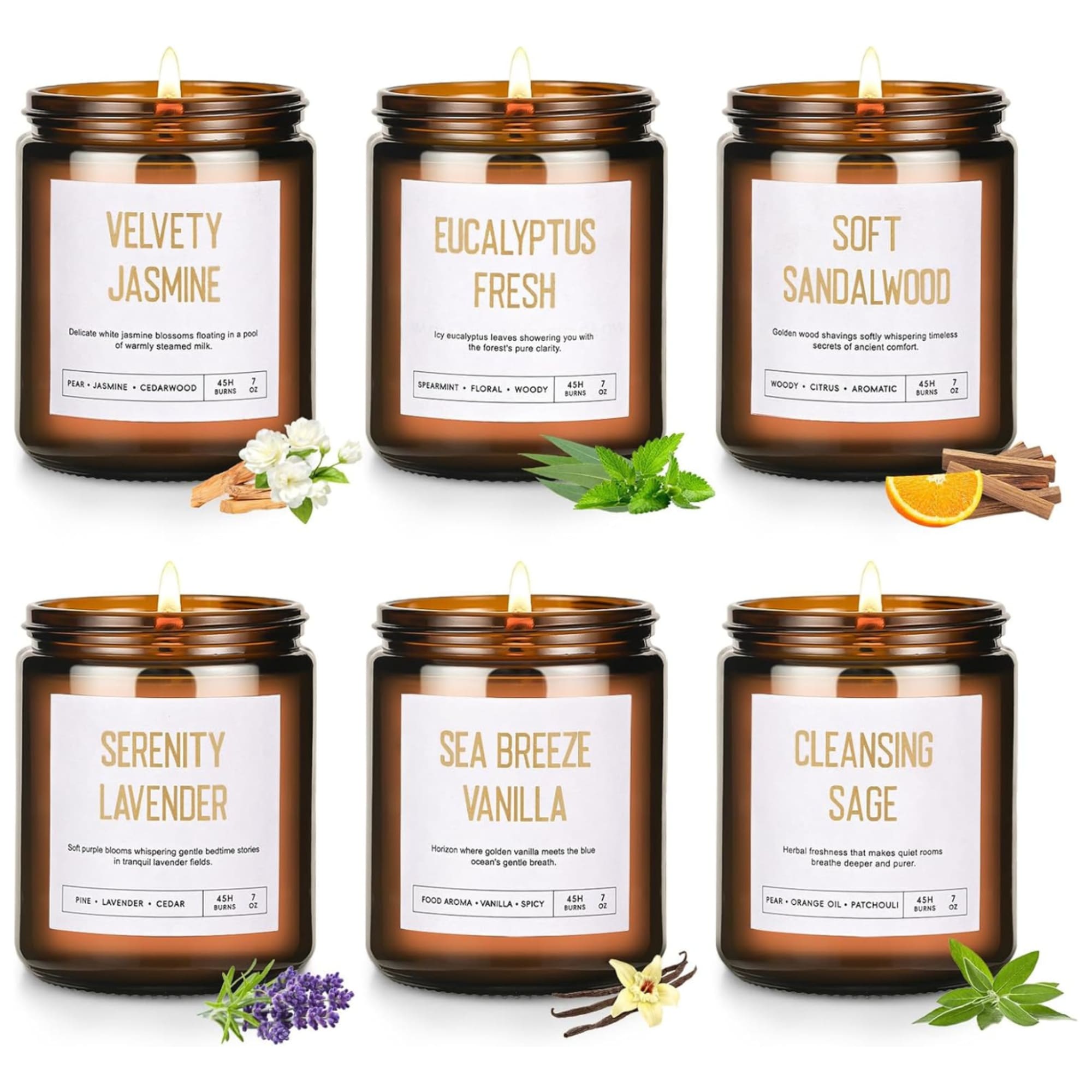 Set of six amber glass jar candles with white labels in assorted scents and small botanical accents.