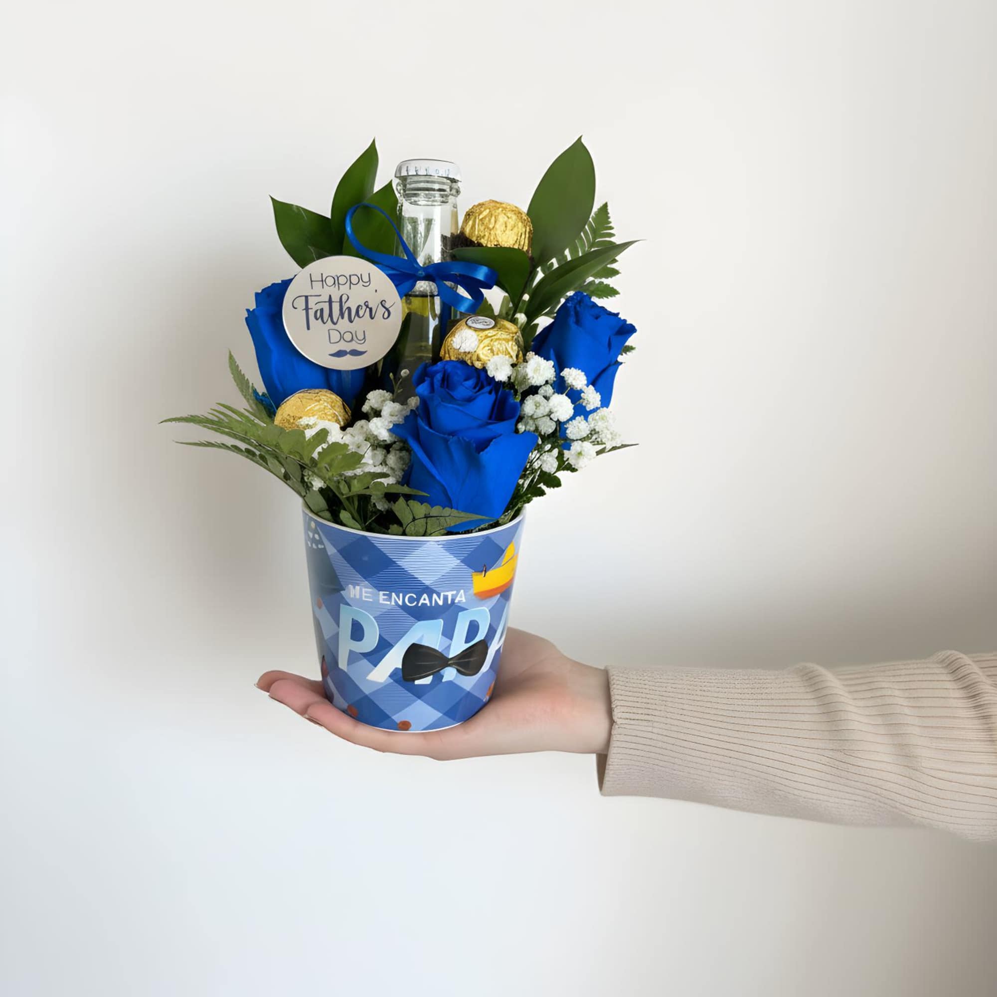 Vivid blue roses clustered with white filler blooms make this Father's Day