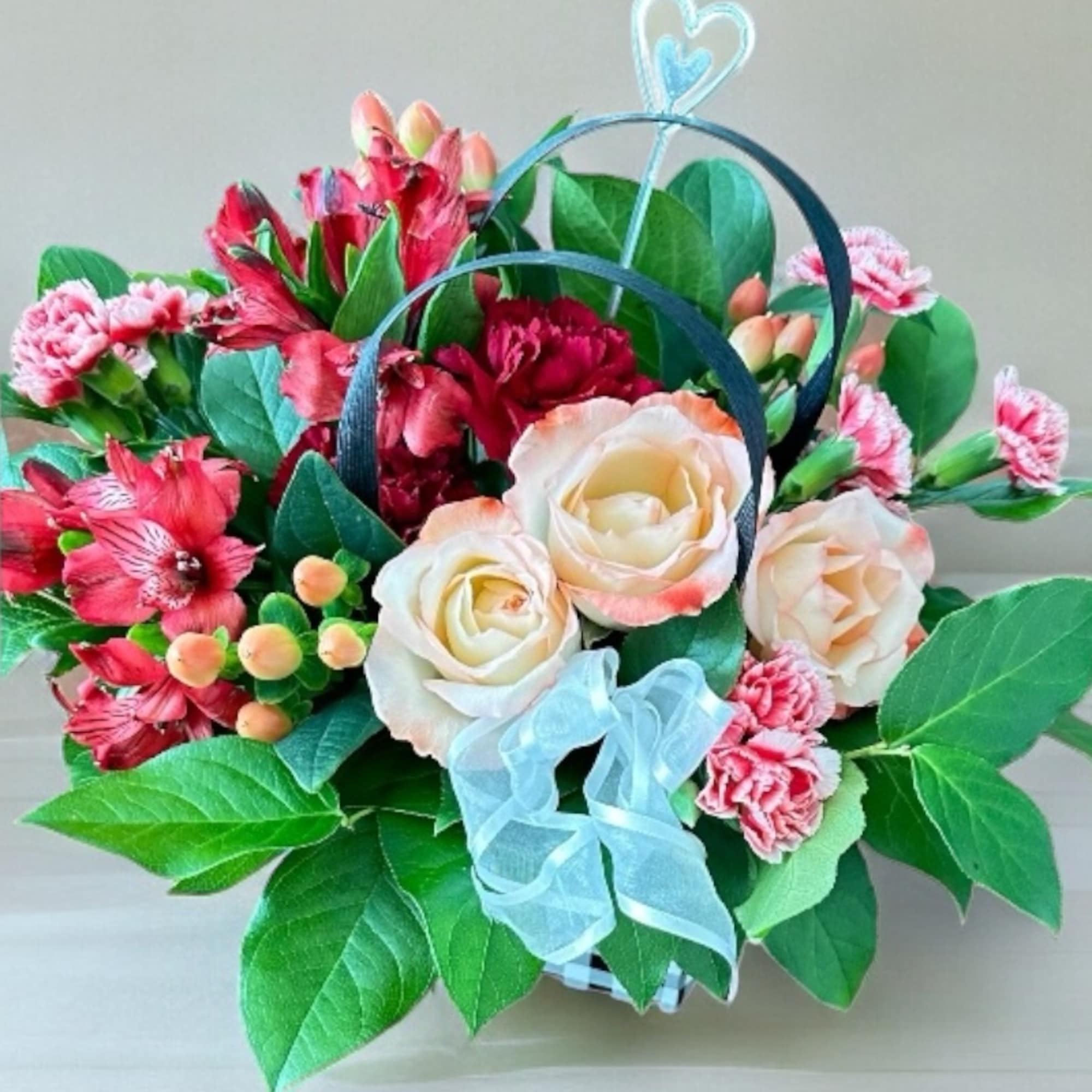 Our Designer&rsquo;s Choice In A Bag arrangement is a modern and elegant