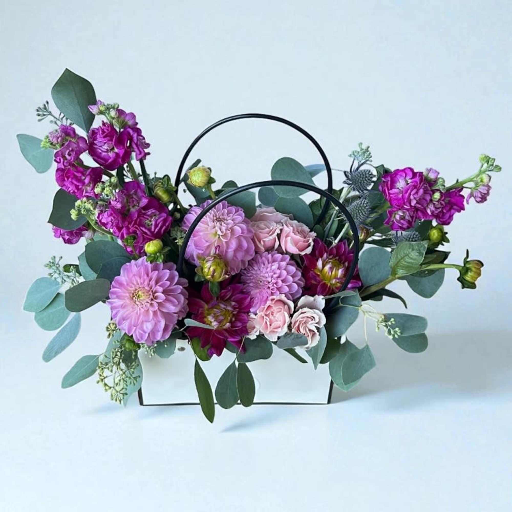 Our Designer&rsquo;s Choice In A Bag arrangement is a modern and elegant