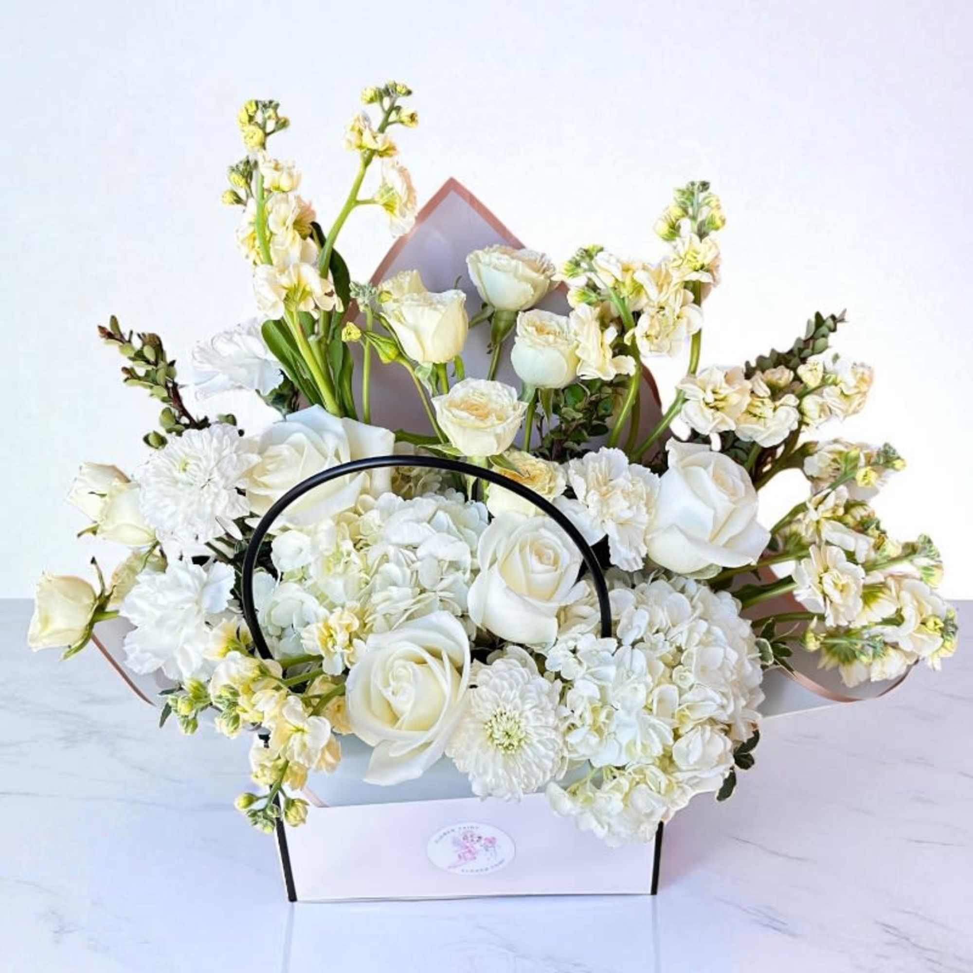 Our Designer&rsquo;s Choice In A Bag arrangement is a modern and elegant