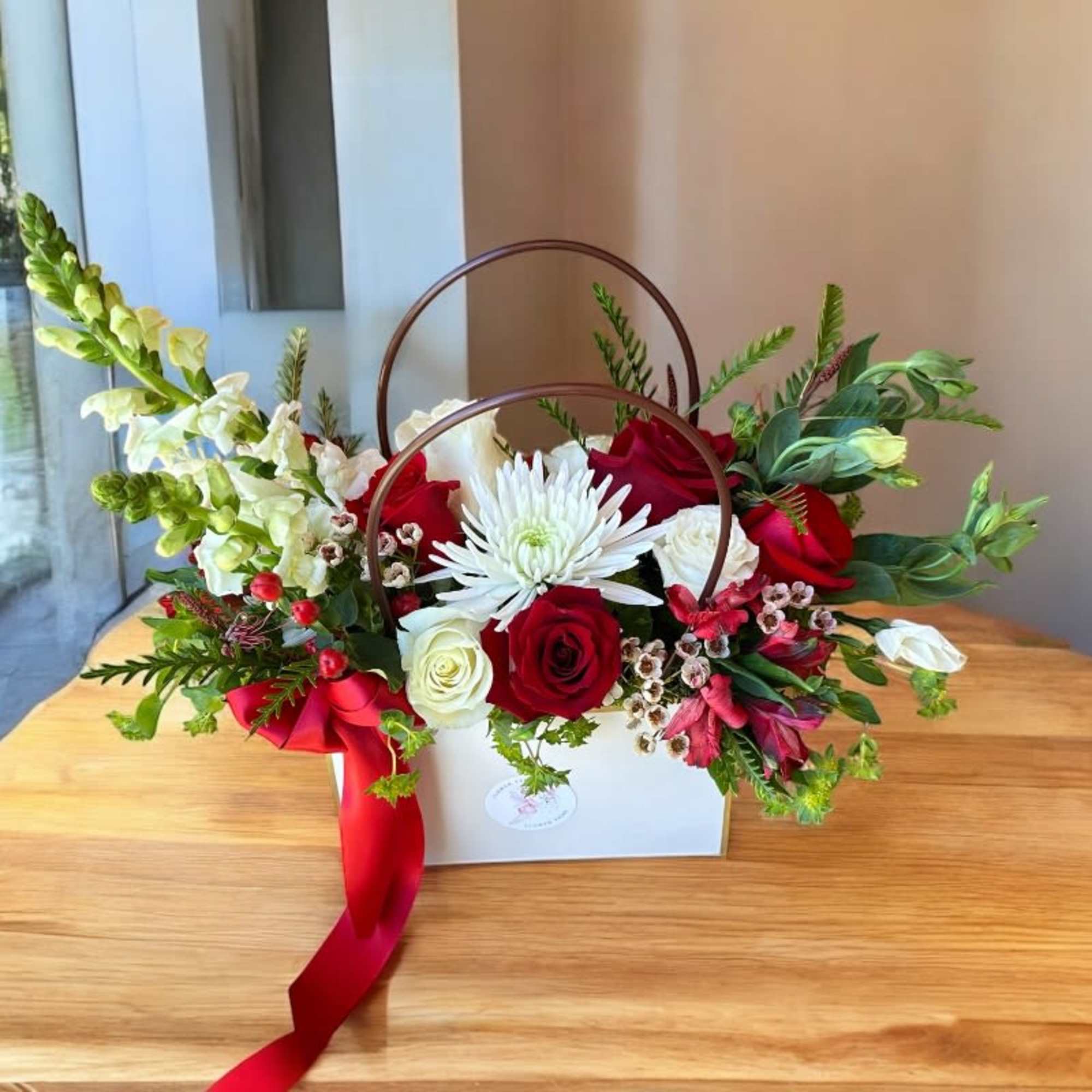 Our Designer&rsquo;s Choice In A Bag arrangement is a modern and elegant