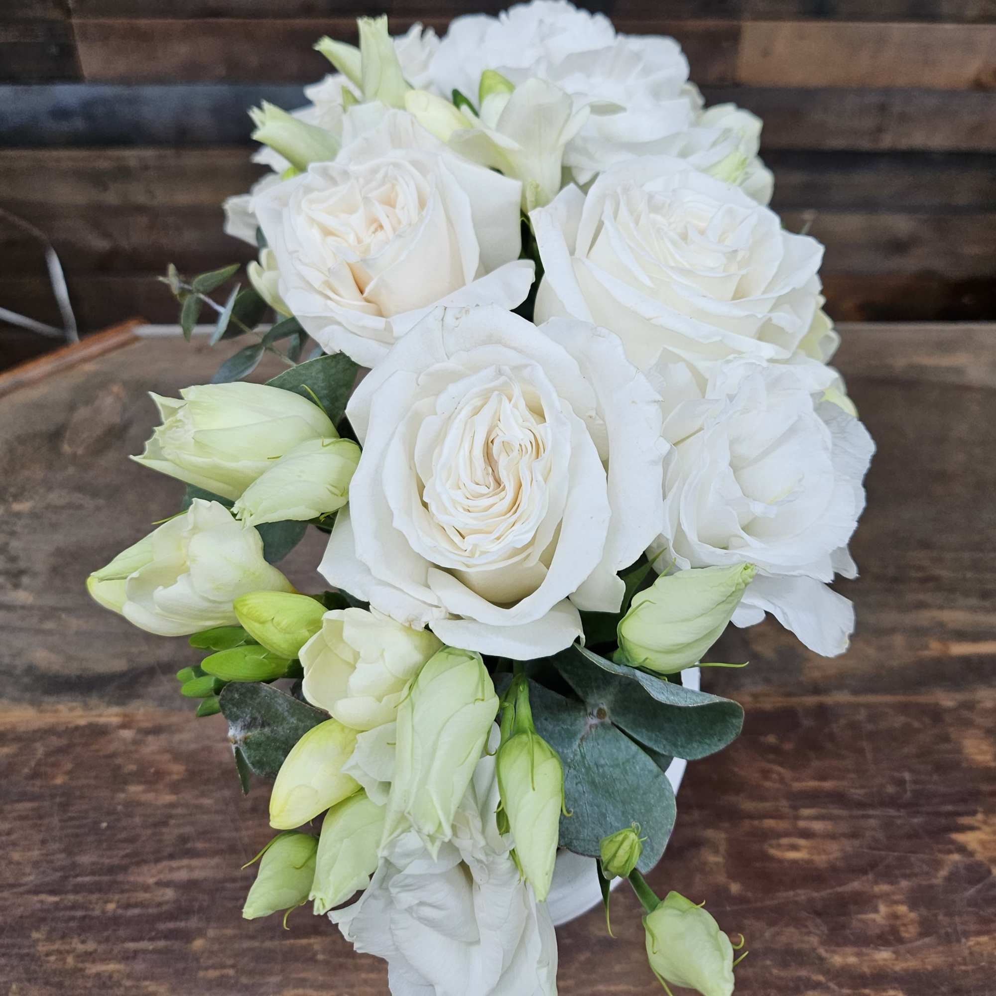 White rose bouquet with pale green buds and eucalyptus