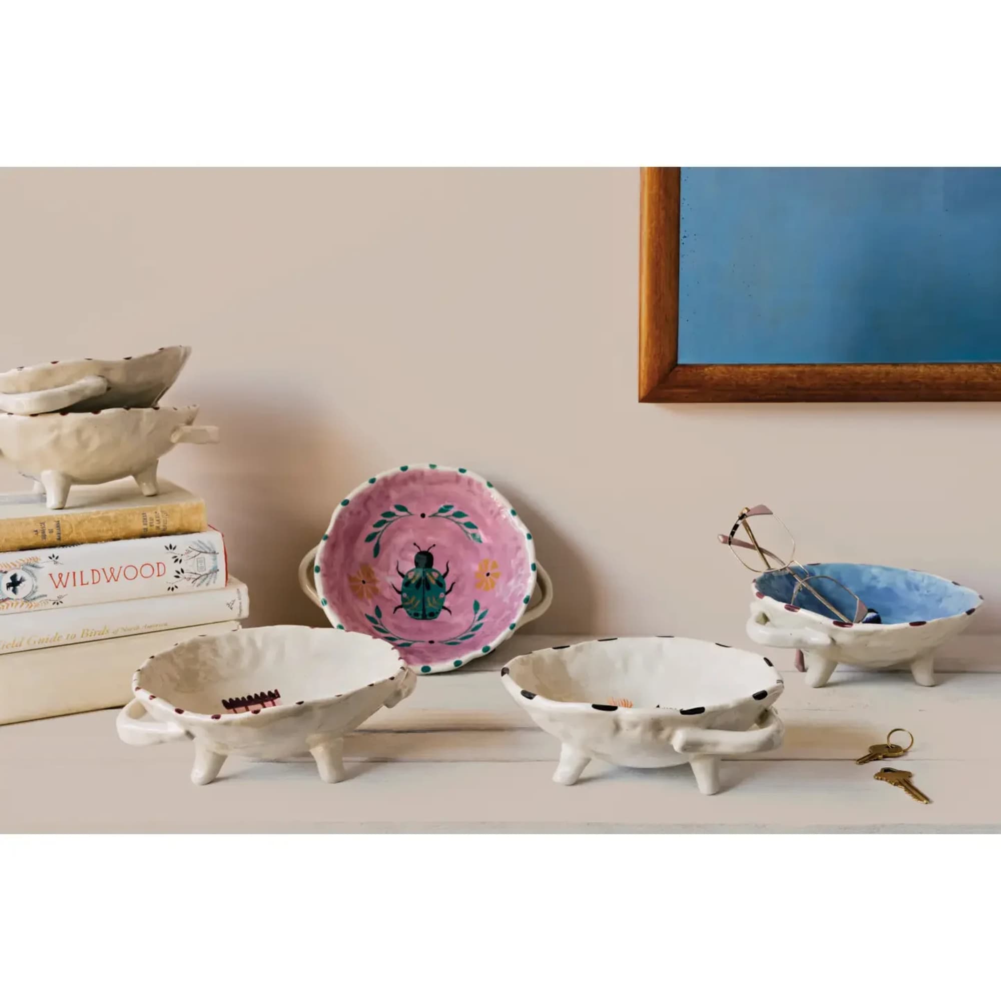 Elevate everyday rituals with our Amulet footed bowl, where a captivating creature