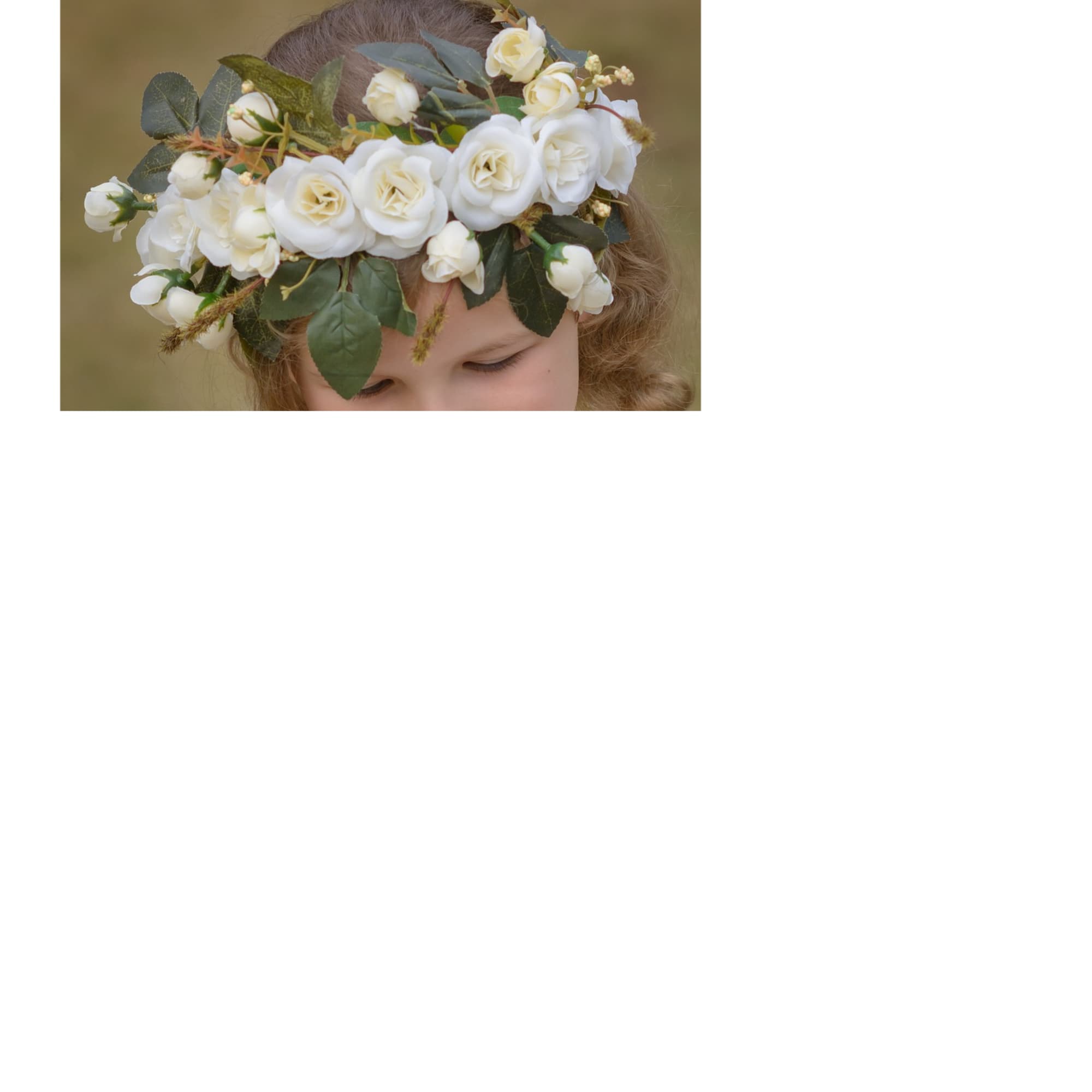 White floral crown with roses on a child's head