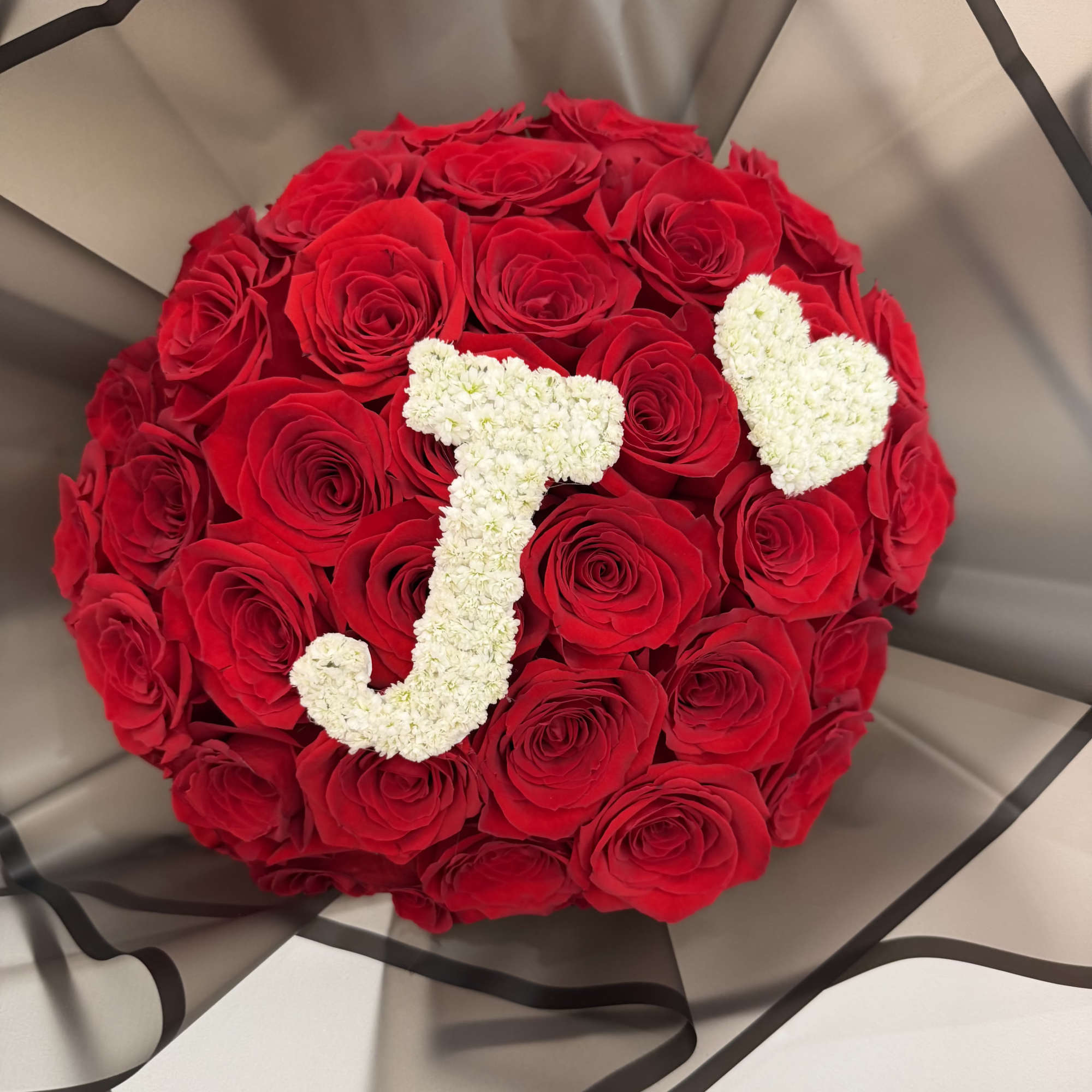 Make a statement with our Initial Love Rose Bouquet, a luxurious arrangement