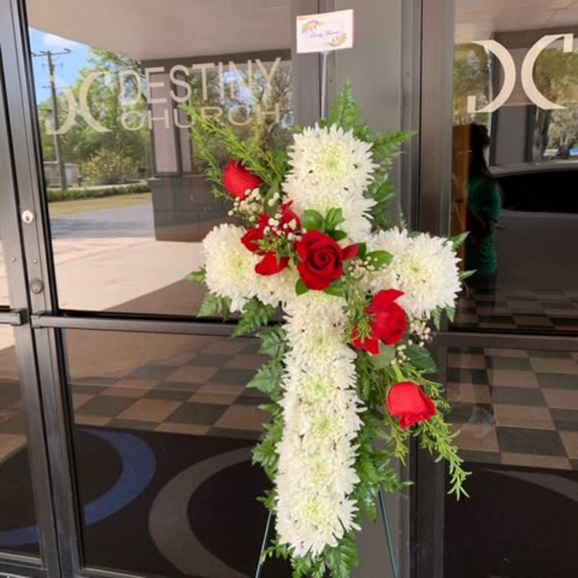 Standing floral cross with white chrysanthemums and red roses