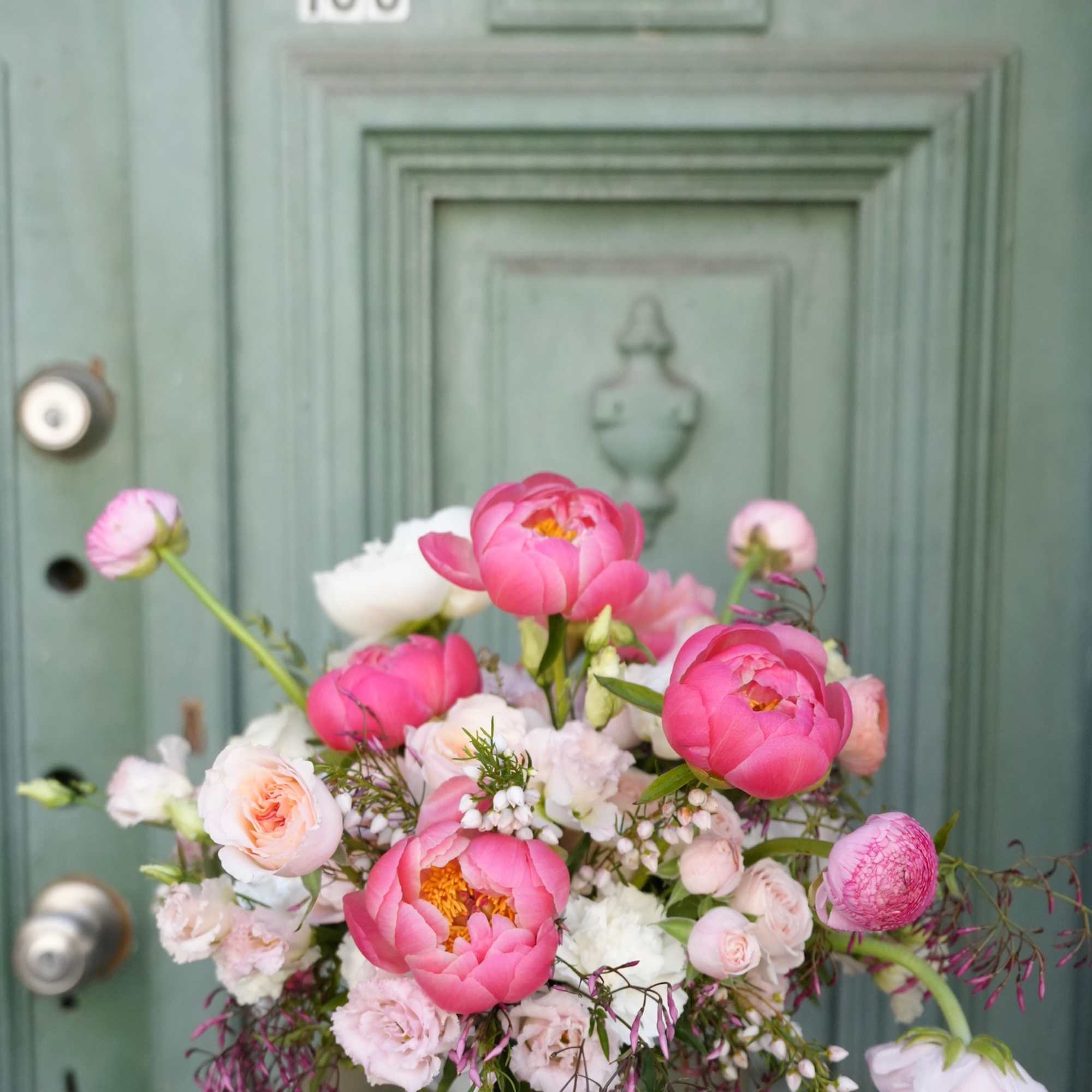 This stunning floral composition creates a harmonious blend of vibrant colors and