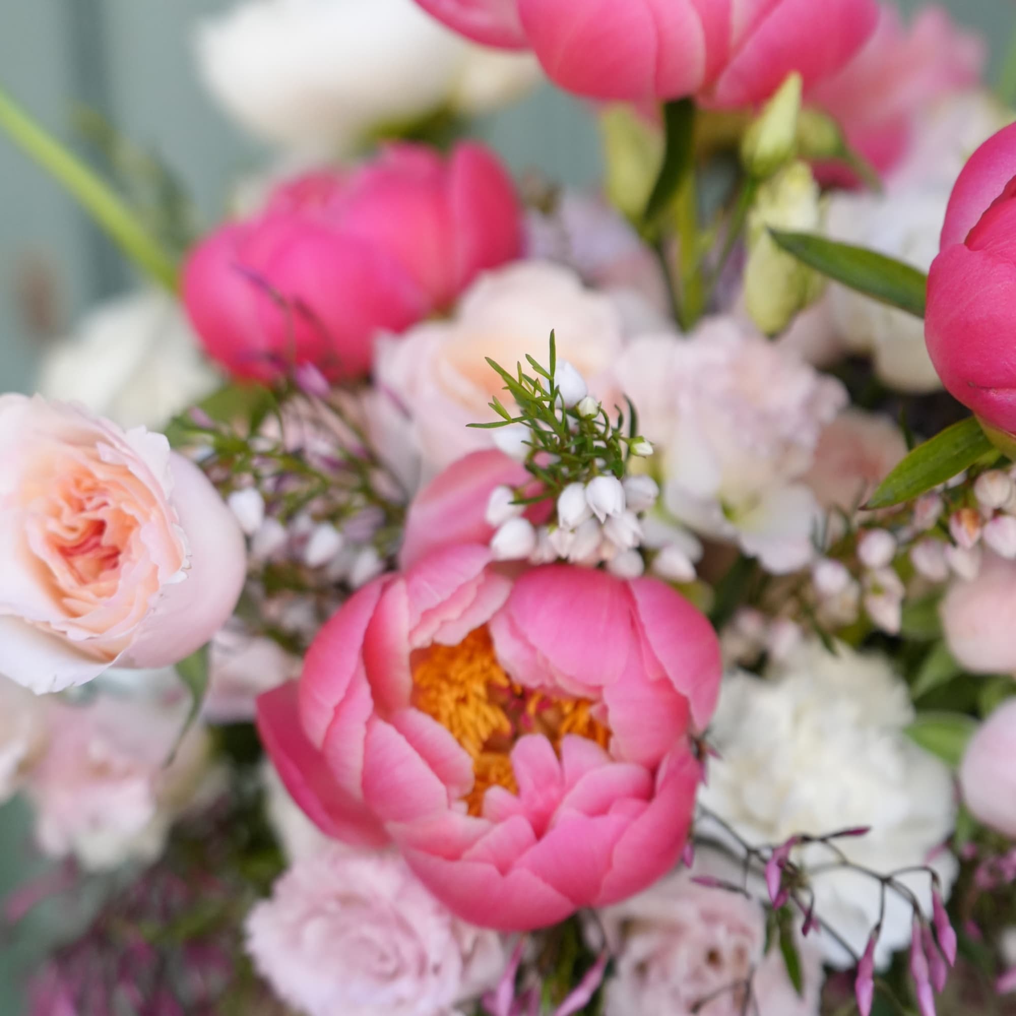 This stunning floral composition creates a harmonious blend of vibrant colors and