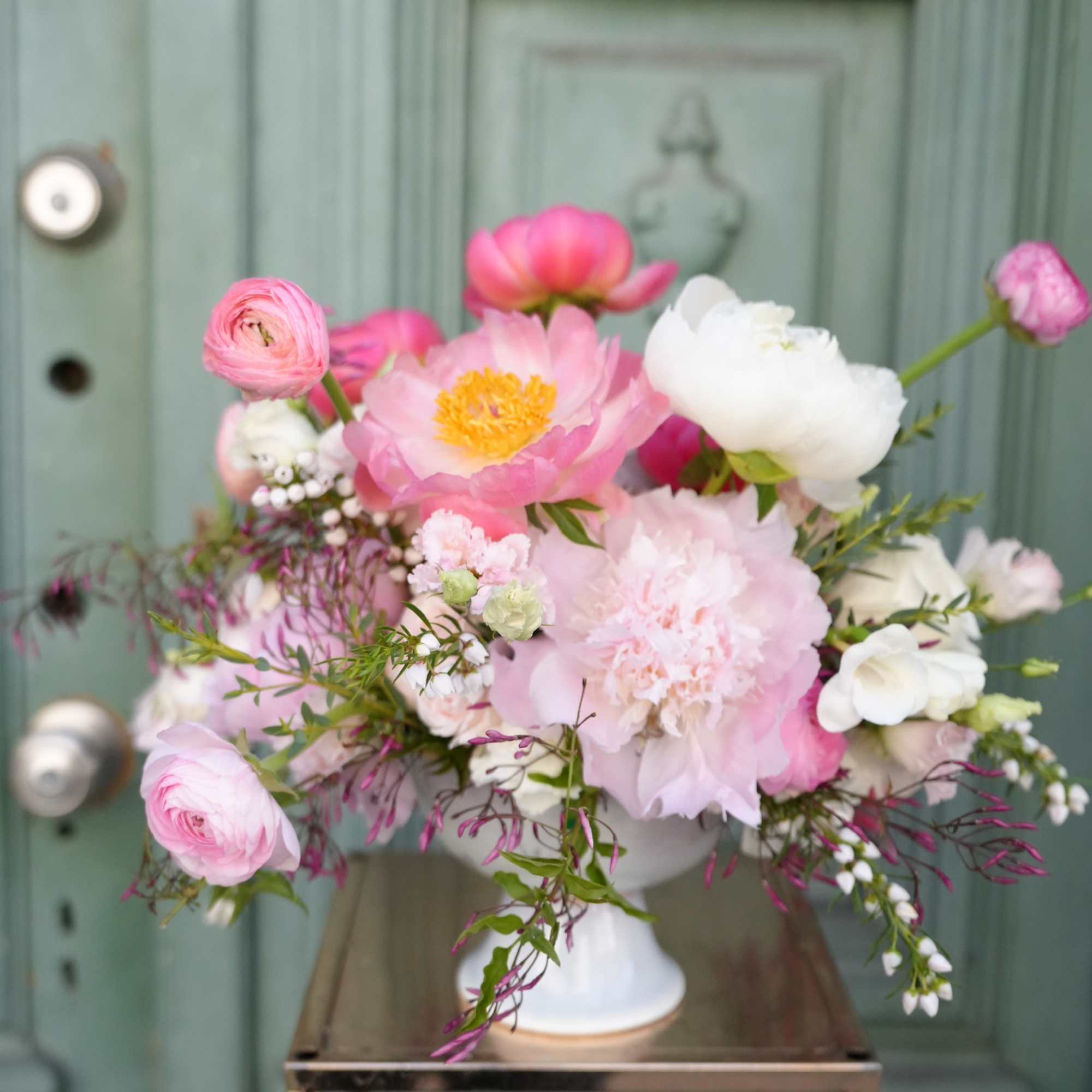 This stunning floral composition creates a harmonious blend of vibrant colors and