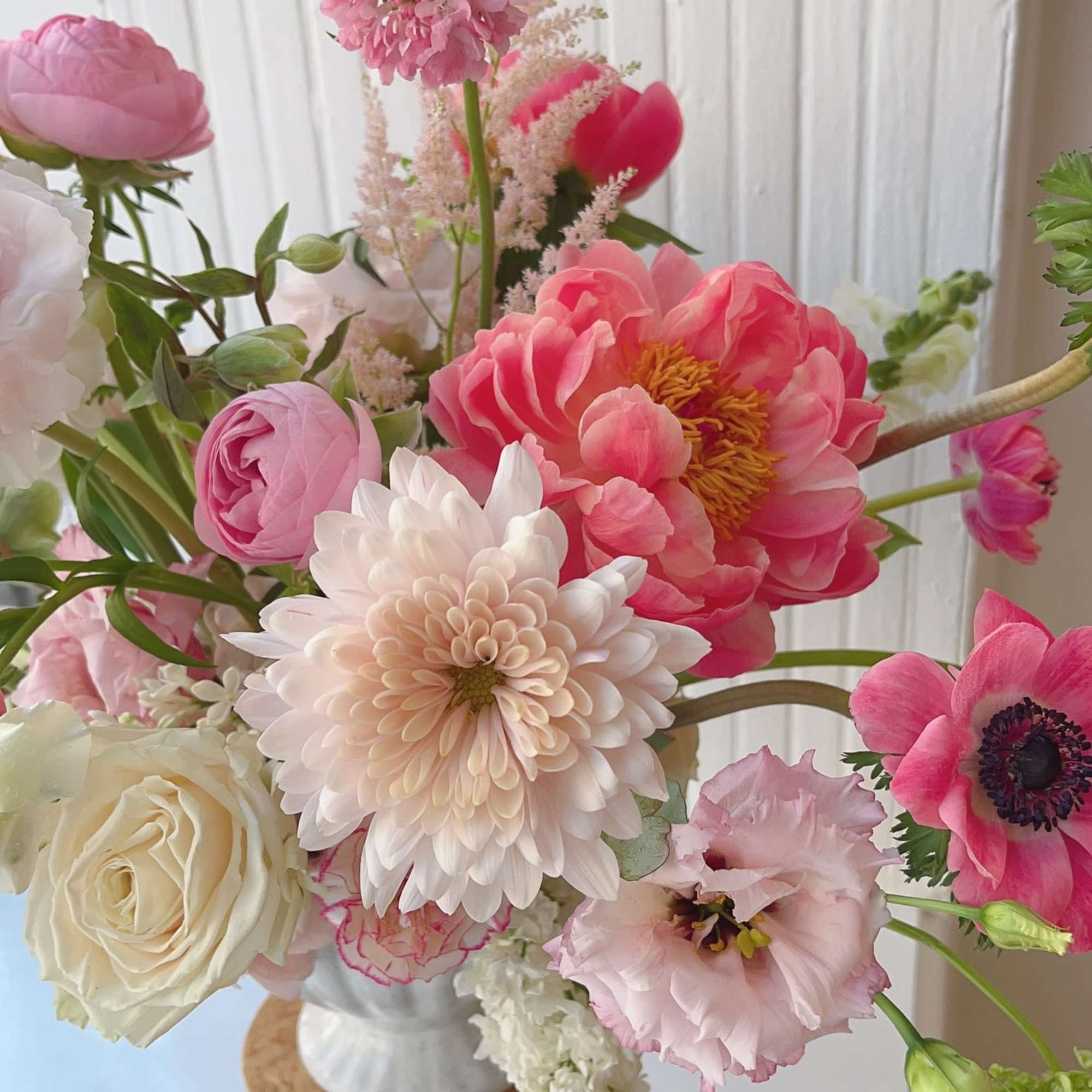 This stunning floral composition creates a harmonious blend of vibrant colors and