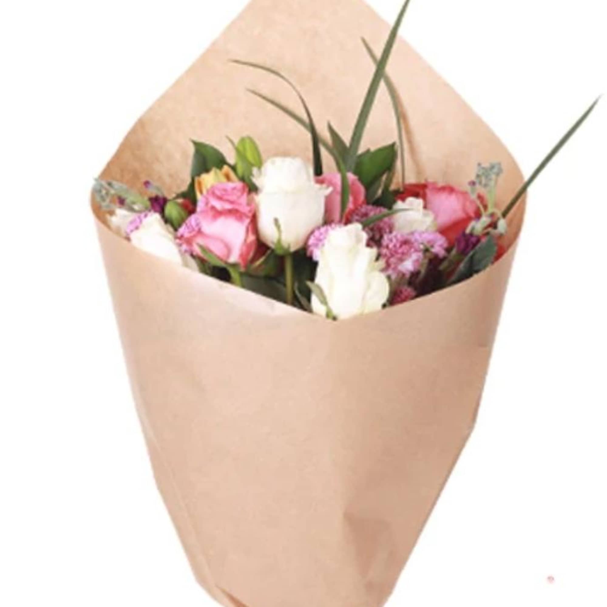 Bouquet of pink and white roses wrapped in tan paper