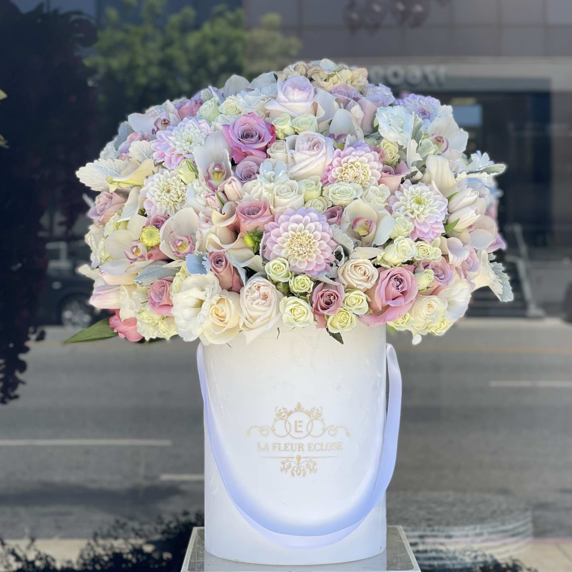 Beautiful arrangement in white and pink colors on our signature velvet white