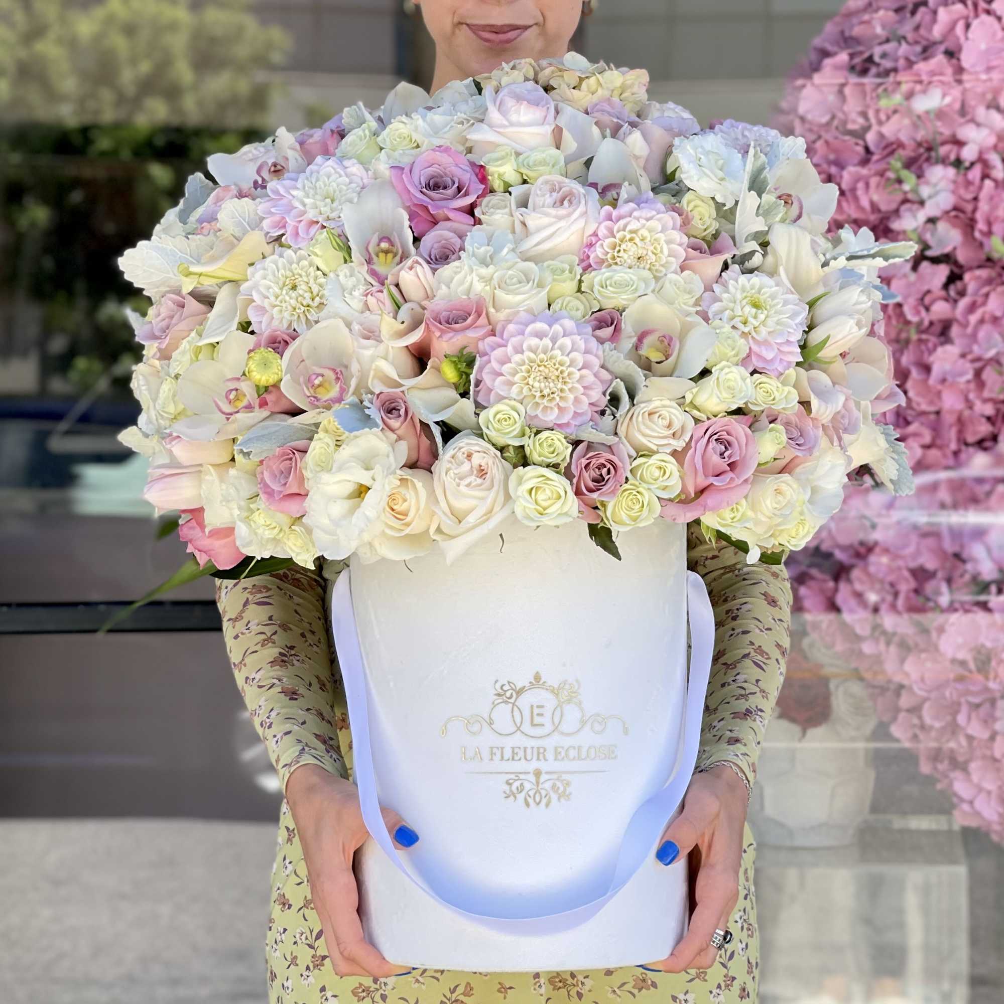 Beautiful arrangement in white and pink colors on our signature velvet white