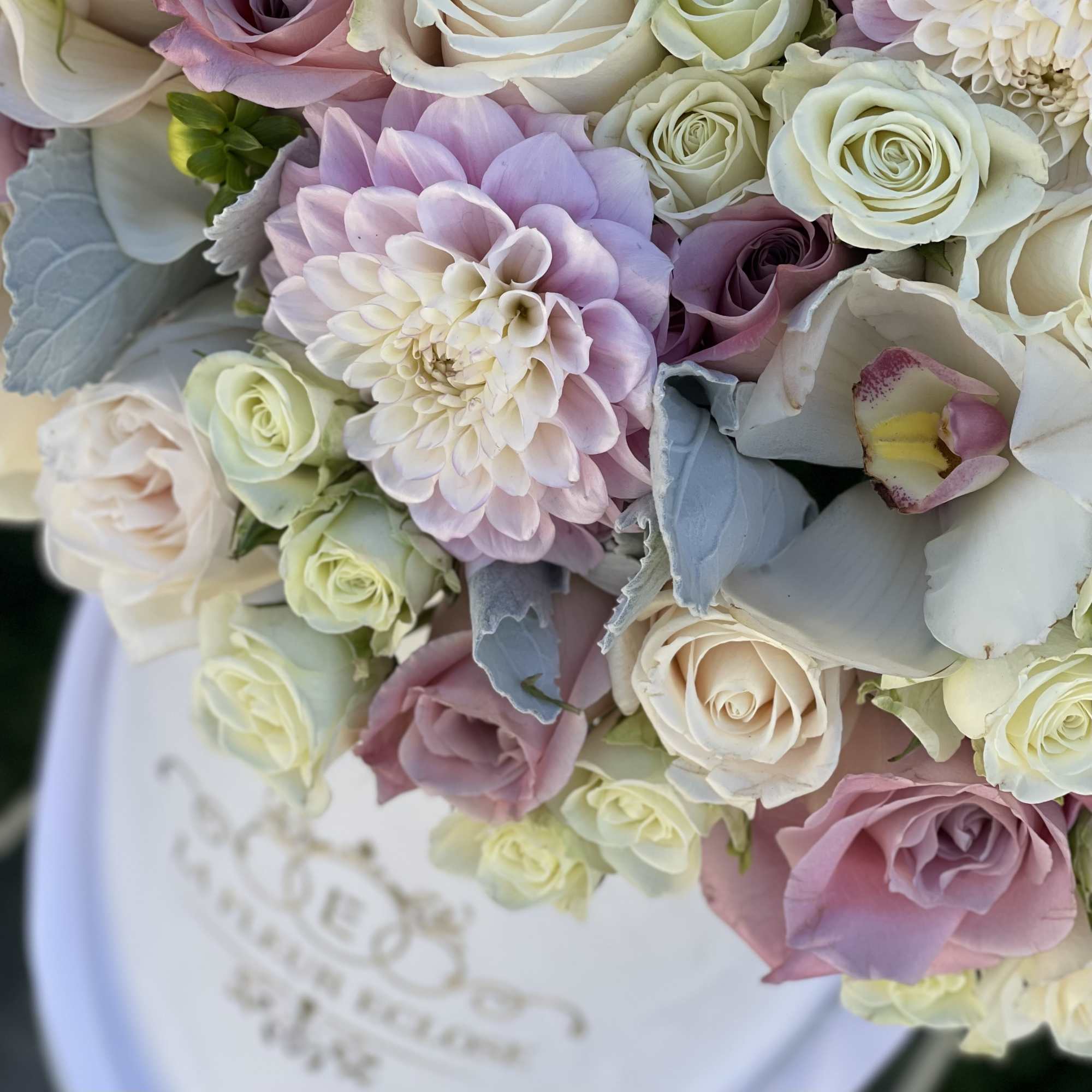 Beautiful arrangement in white and pink colors on our signature velvet white
