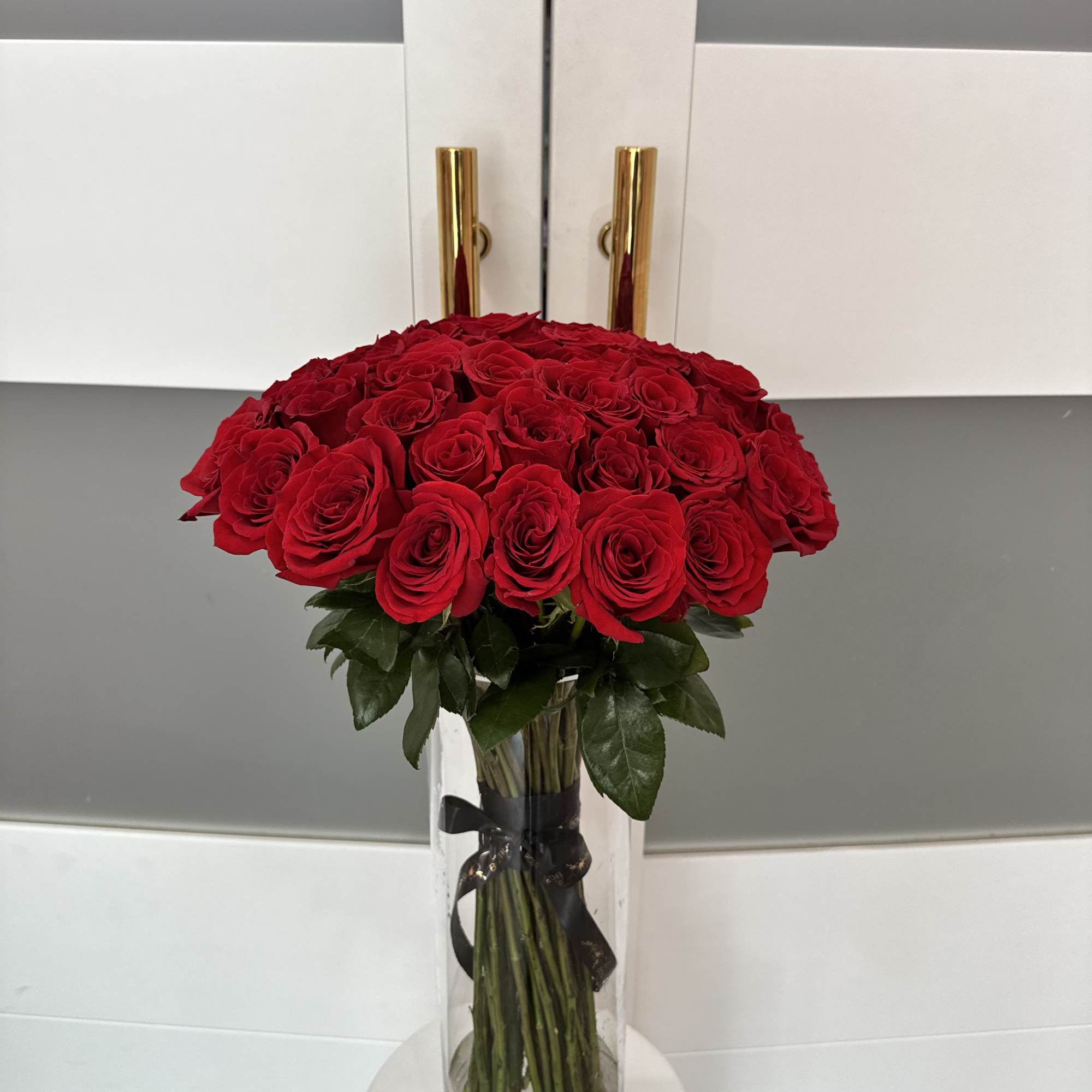 Bouquet of red roses in a clear glass vase
