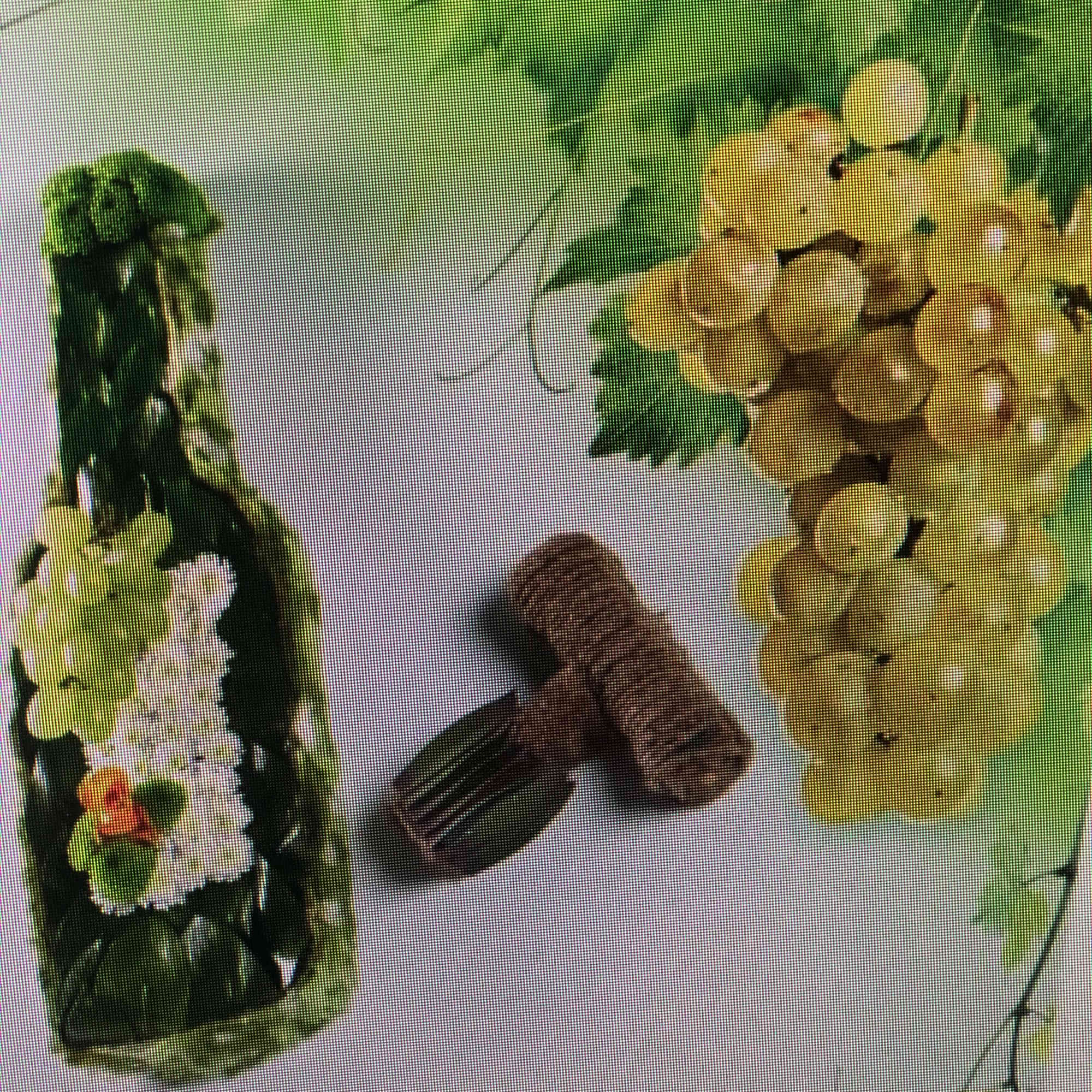Two floral garlands with yellow and white blossoms and a small brown comb-like accessory