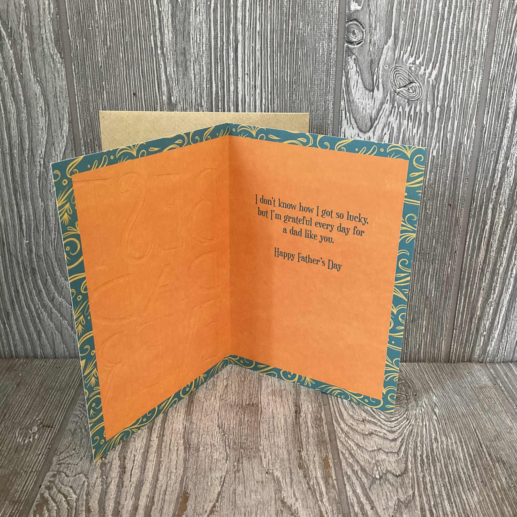 Orange Father's Day greeting card with teal patterned border