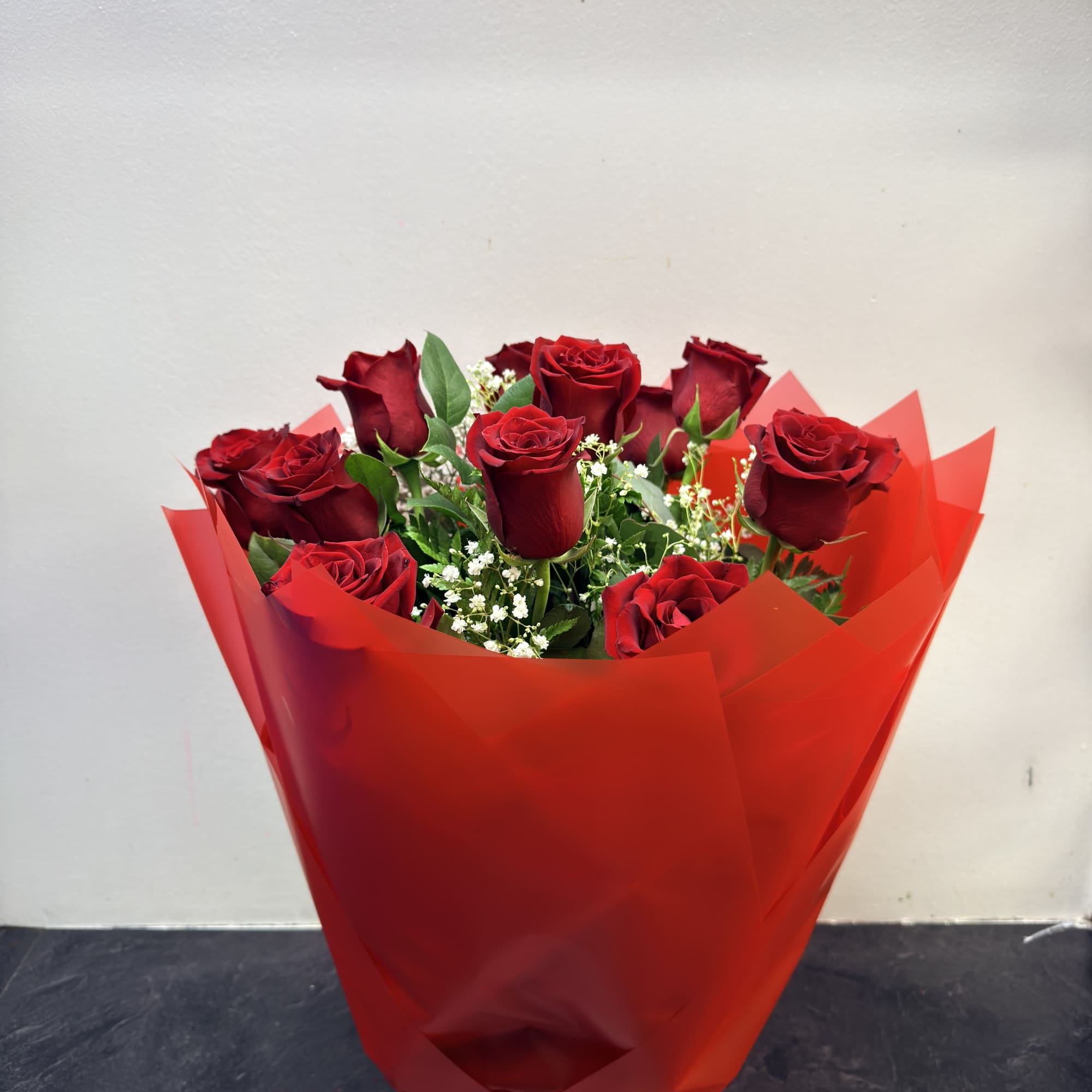 this arrangement is made with fresh roses and wrapped up nice. 