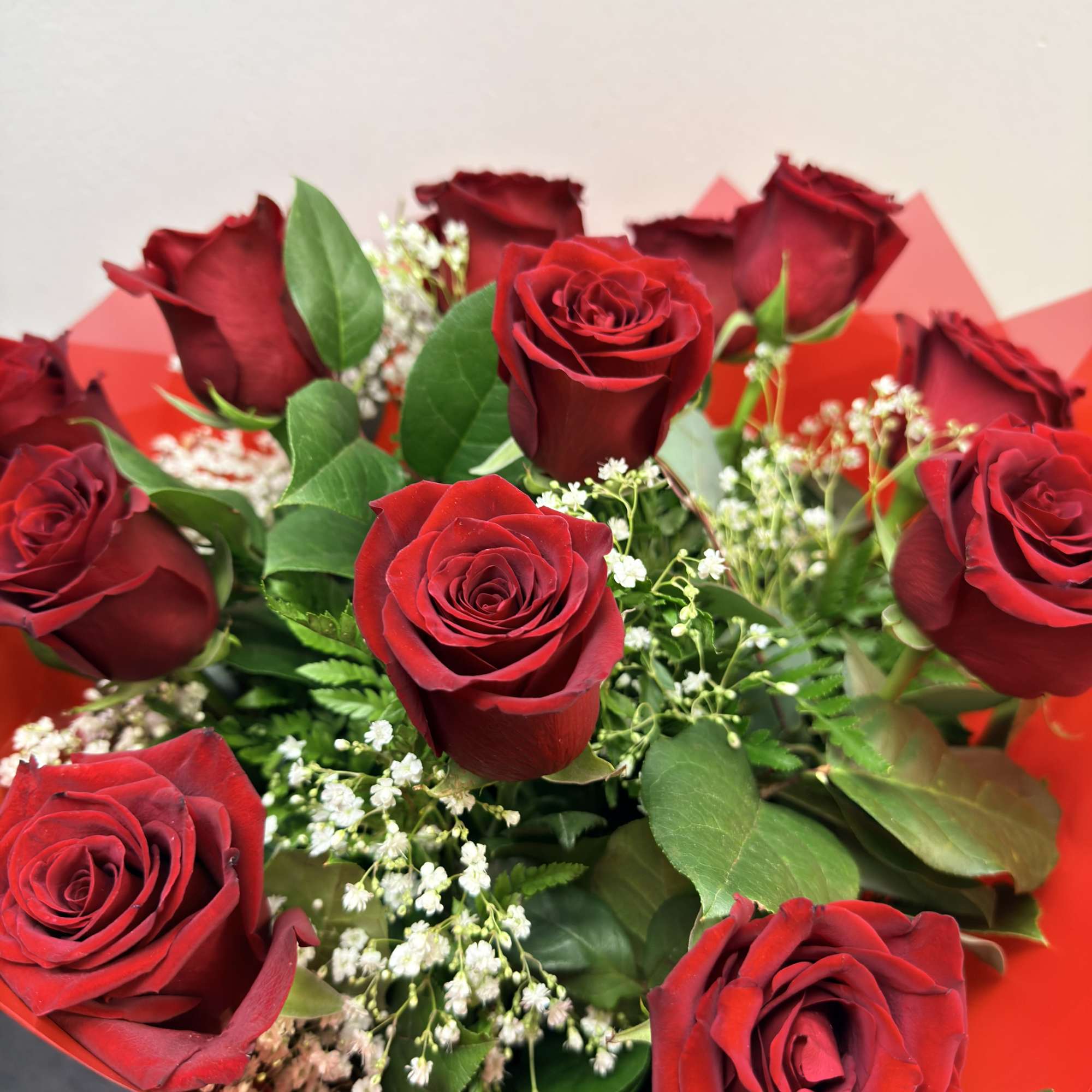 this arrangement is made with fresh roses and wrapped up nice. 