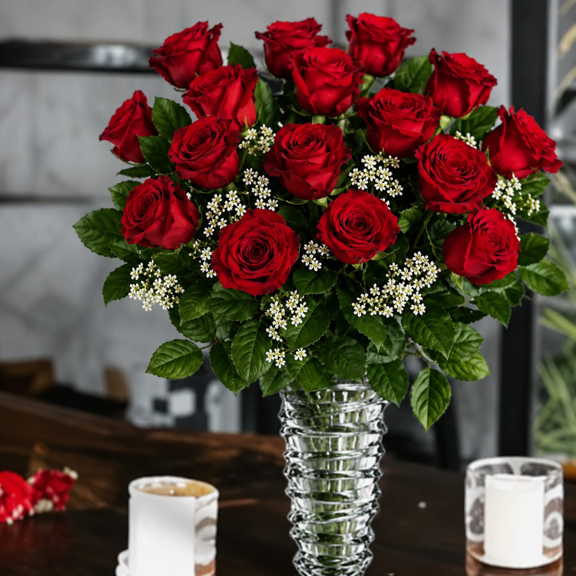 A timeless arrangement of premium red roses, delicate white wax flowers, and