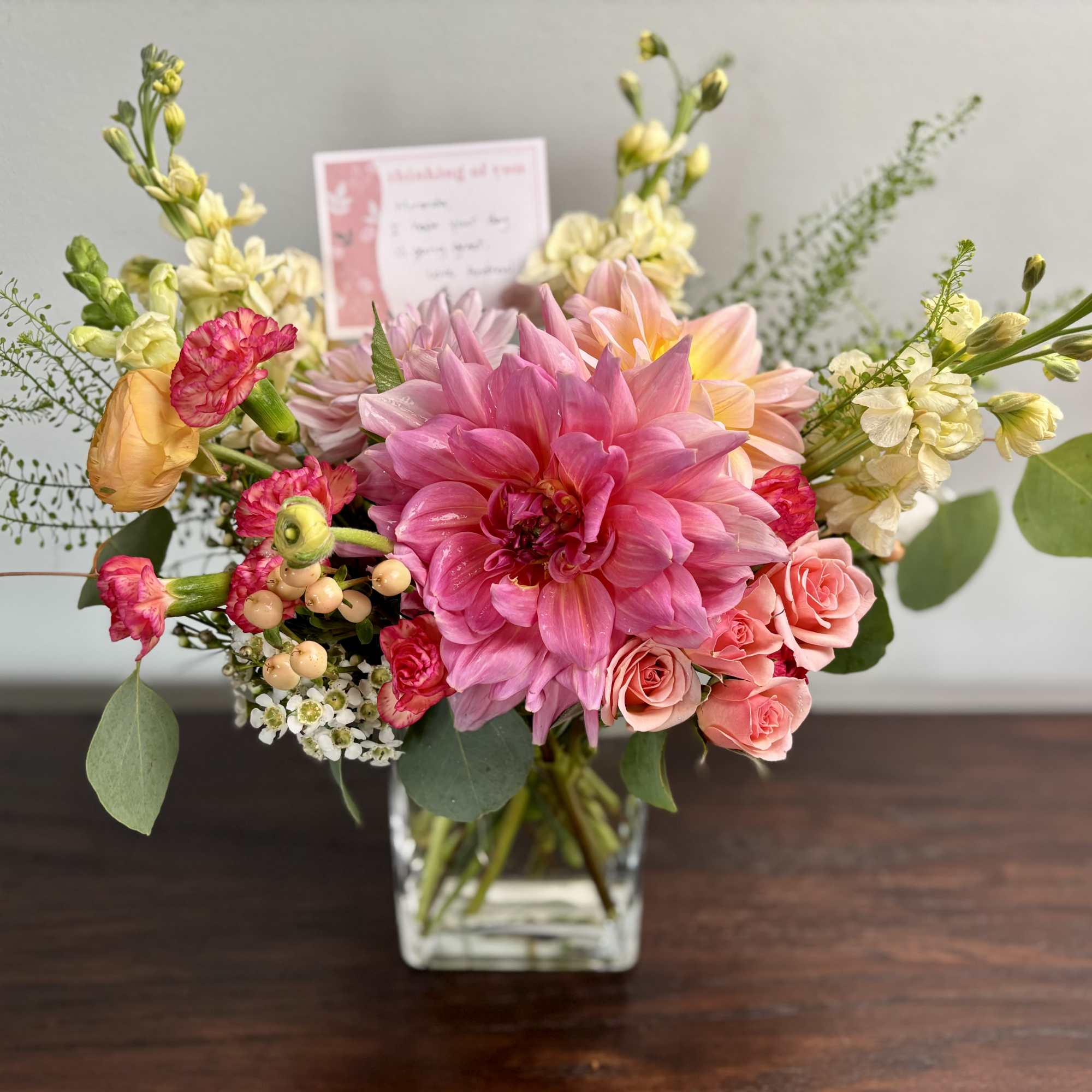 Pink and peach mixed bouquet in a clear glass vase