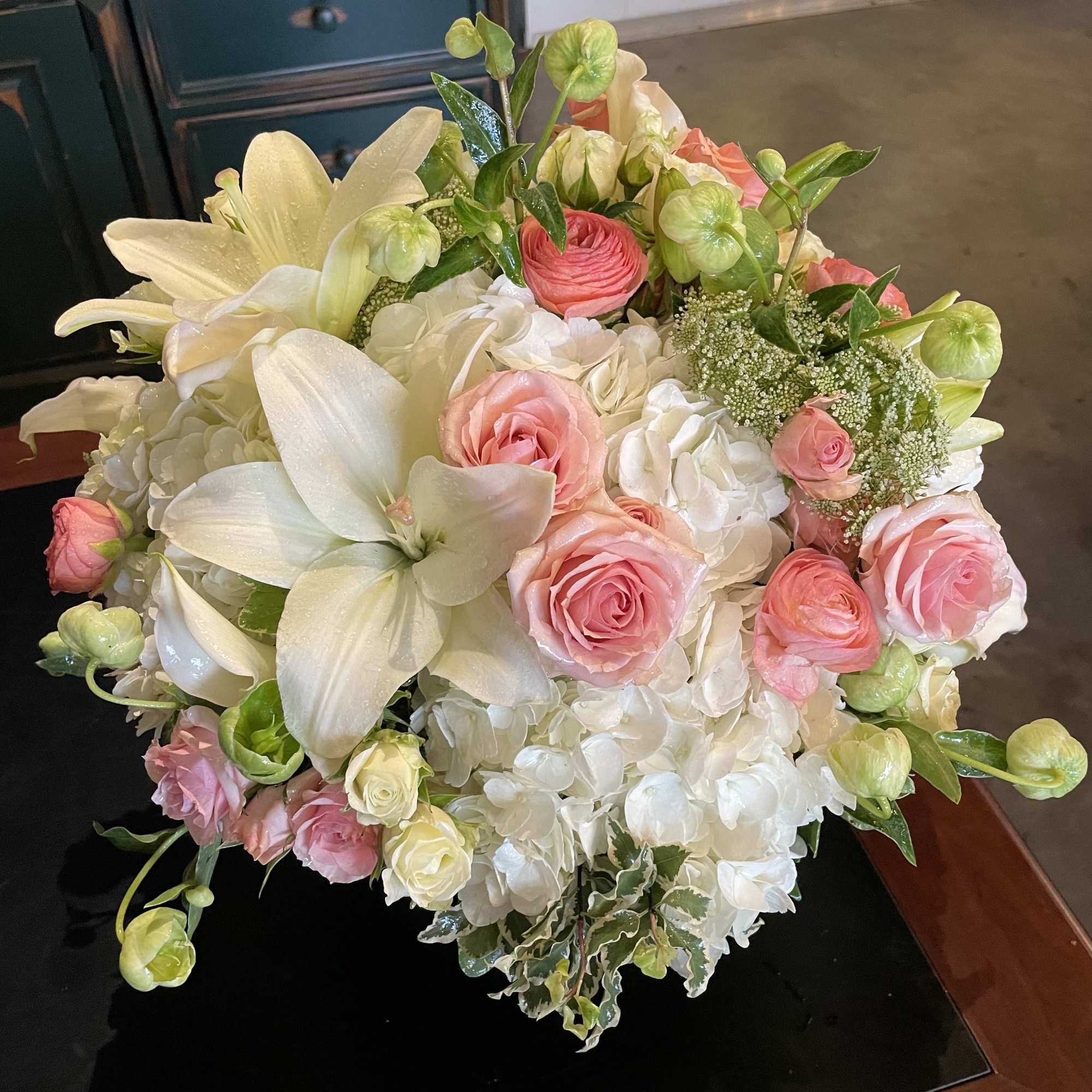 Bouquet of pink roses, white lilies, and white hydrangeas