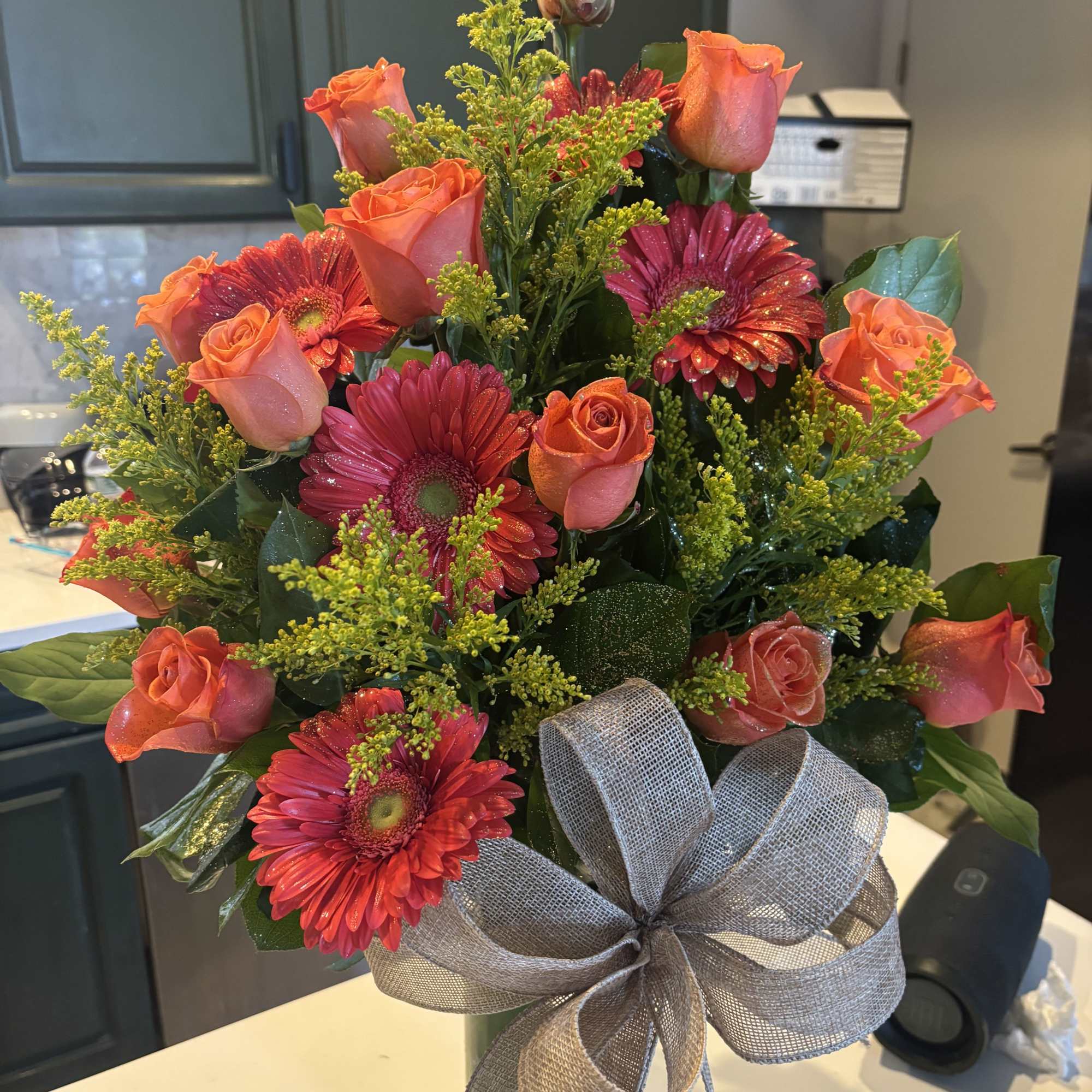 Mix flower bouquet arranged on glass vase with modern look 