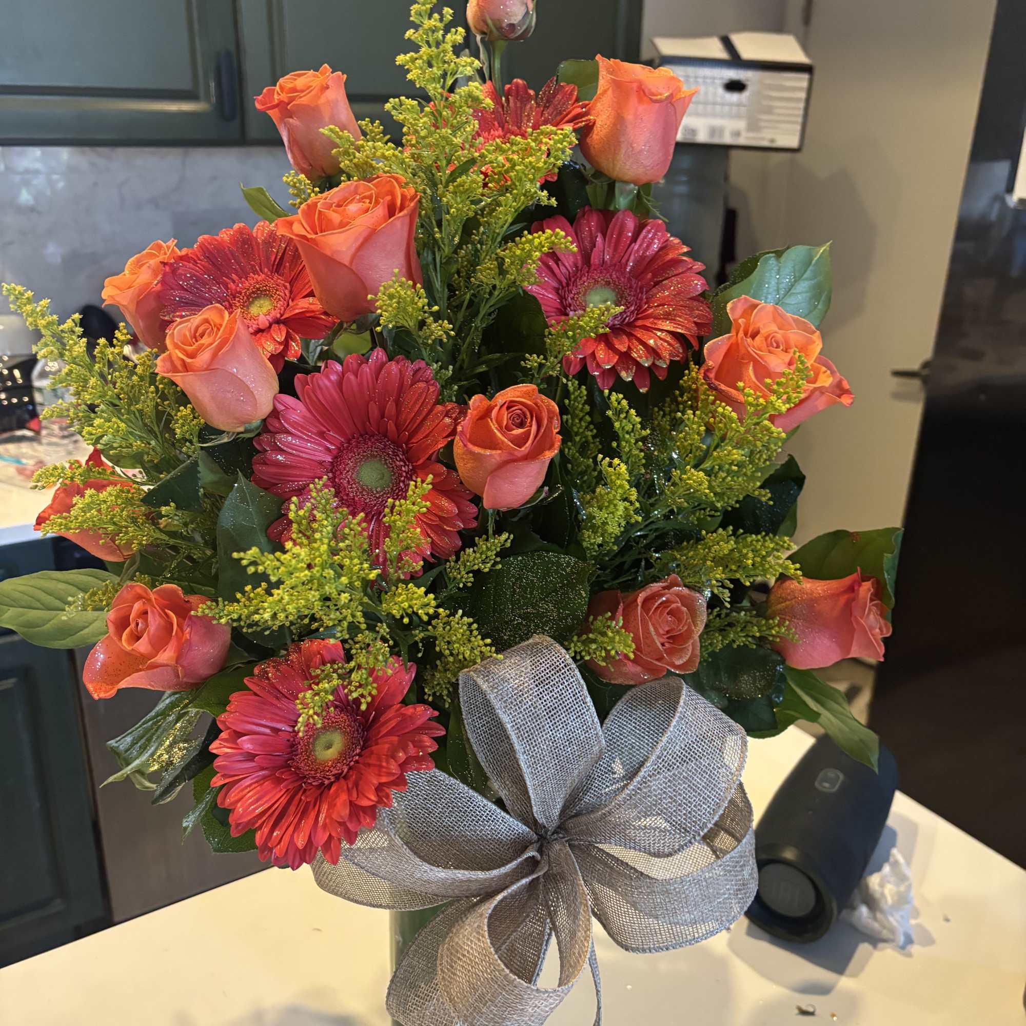 Mix flower bouquet arranged on glass vase with modern look 