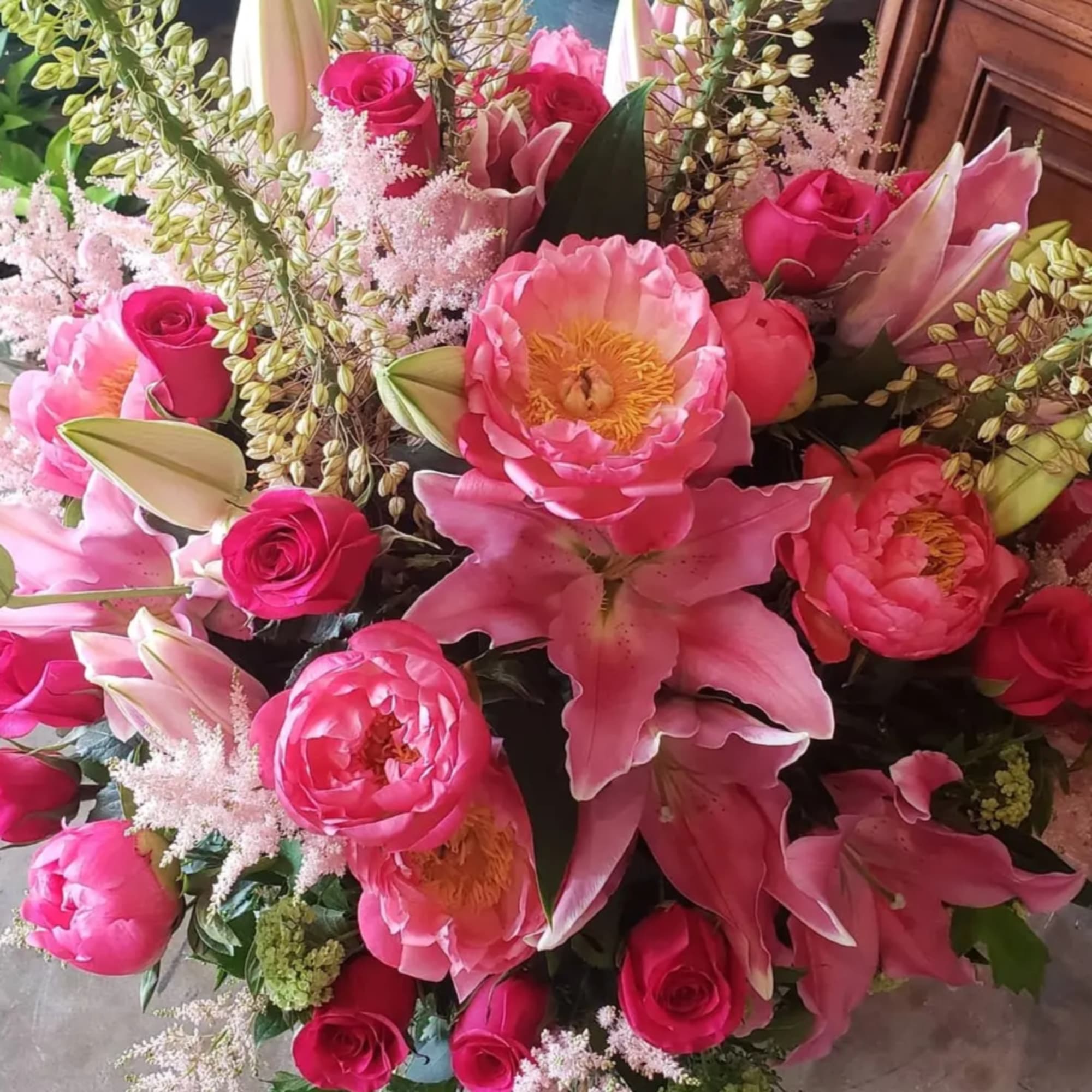 Pink bouquet with roses, lilies, and peonies