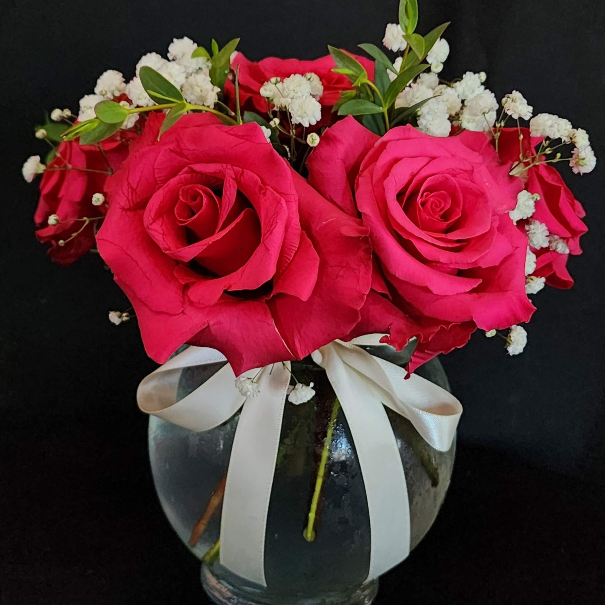 Half a dozen, 1 dozen, 2 dozen roses with greens and fillers