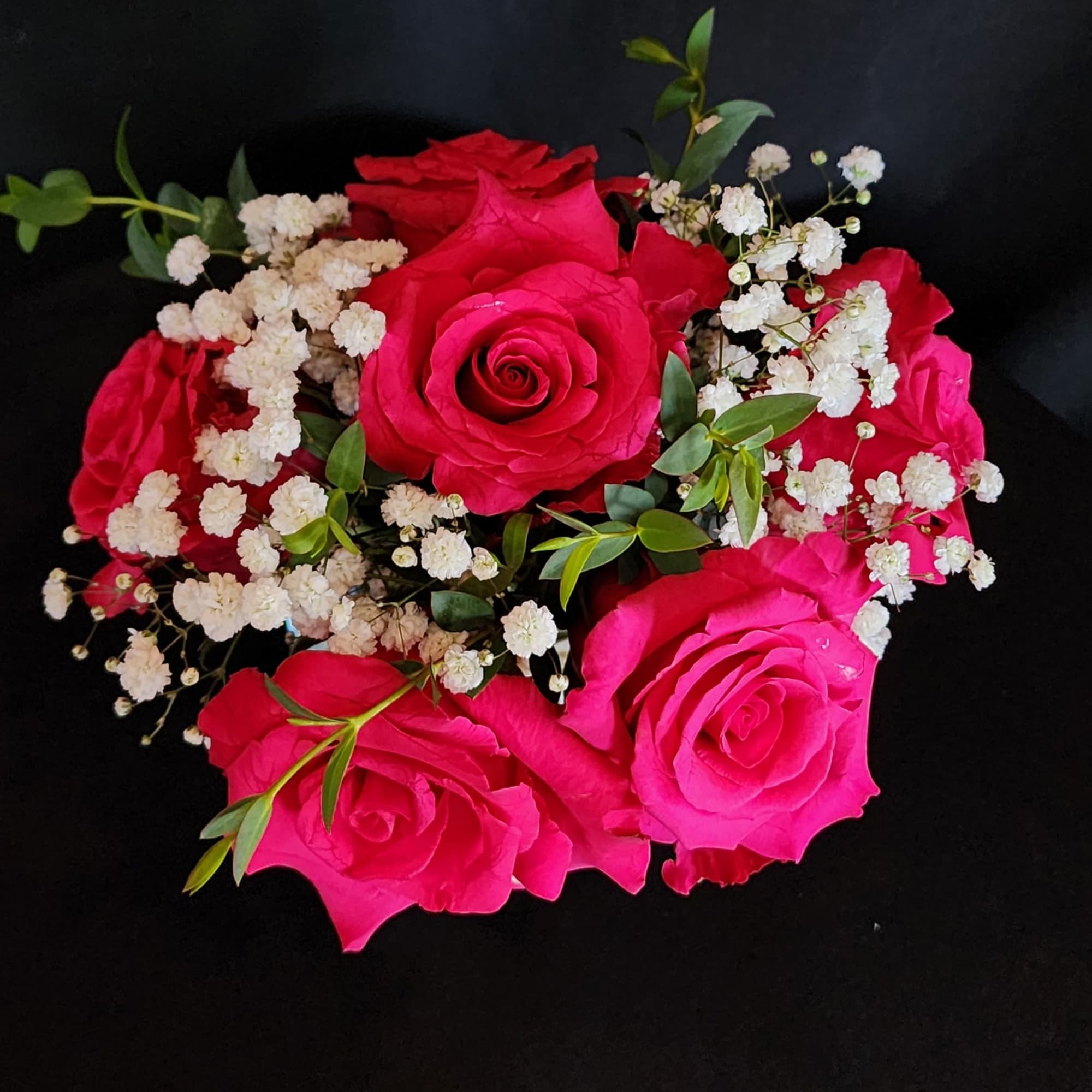 Half a dozen, 1 dozen, 2 dozen roses with greens and fillers