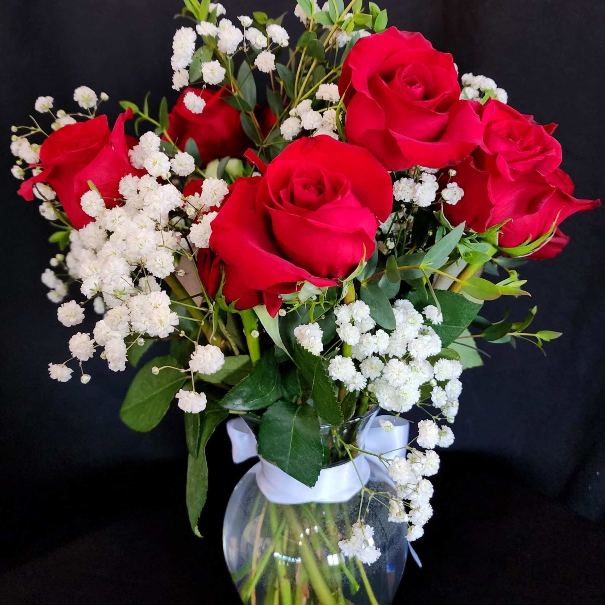 Half a dozen, 1 dozen, 2 dozen roses with greens and fillers