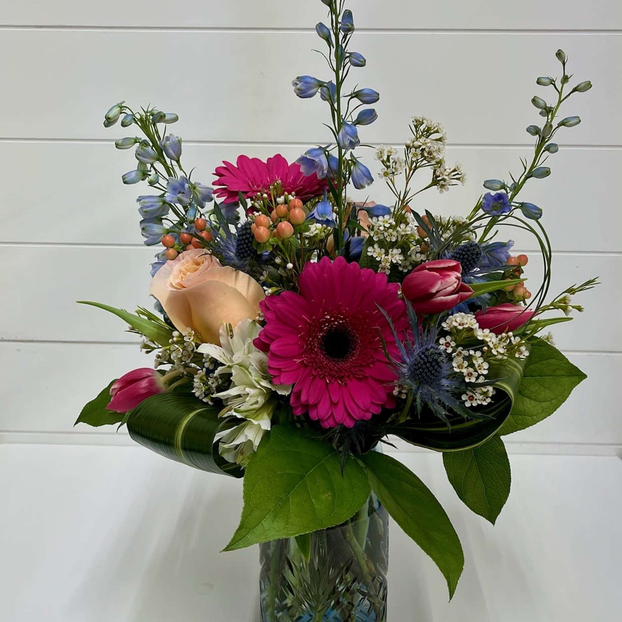 Soft, fresh, and full of spring charm, the Peachy Sky Arrangement brings