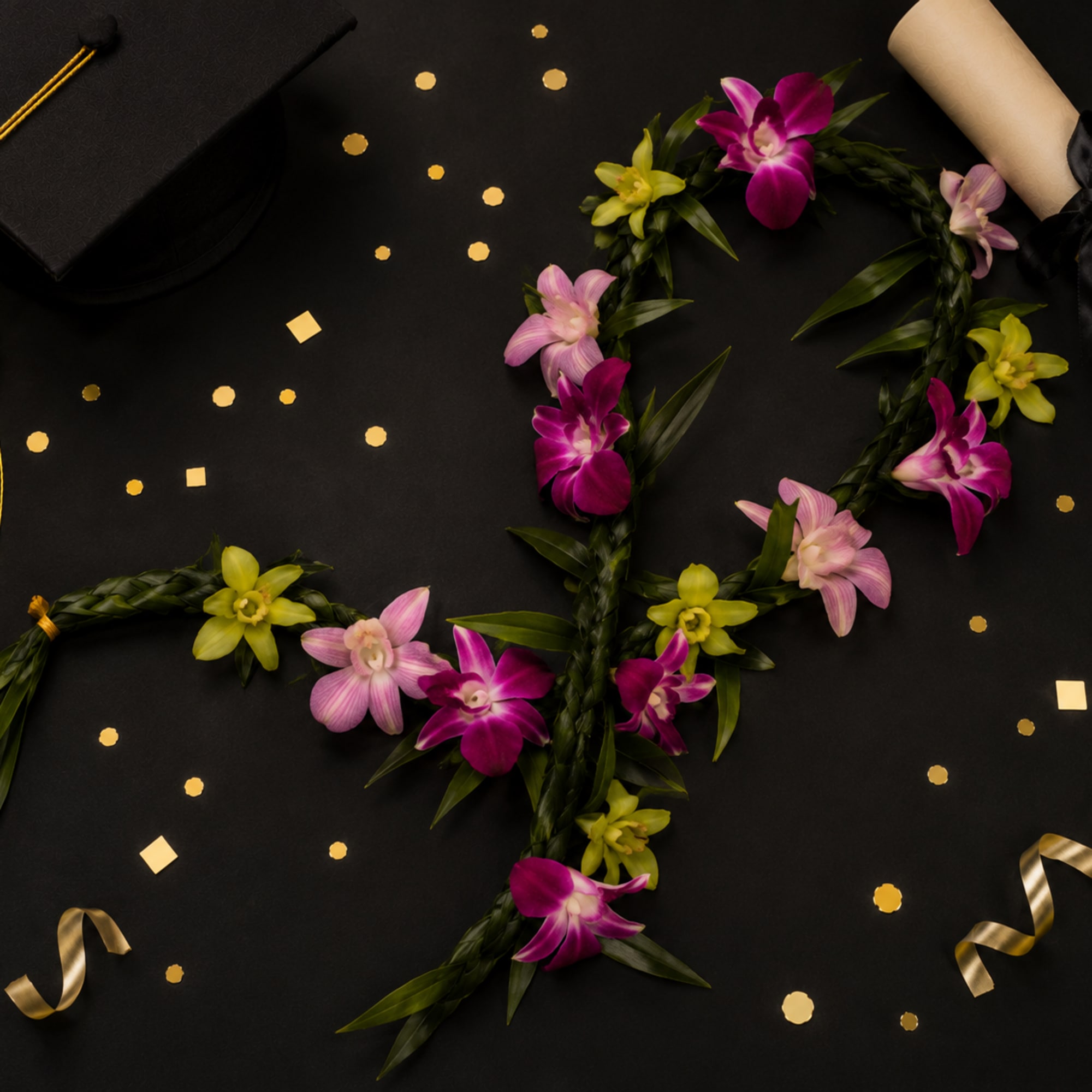 This beautiful lei made with mix colors dendrobium and to leaf 