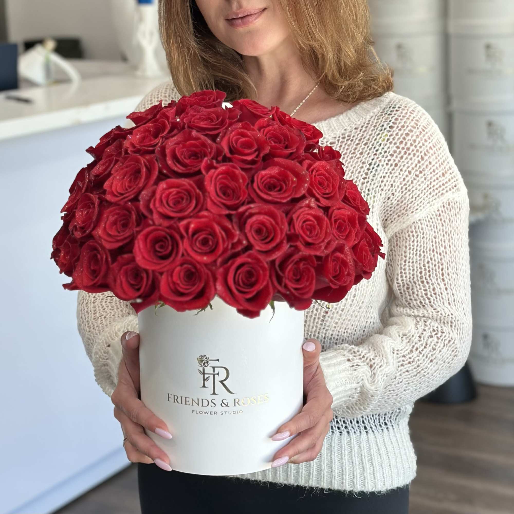 Luxurious red roses arranged in our signature Friends &amp; Roses box. A