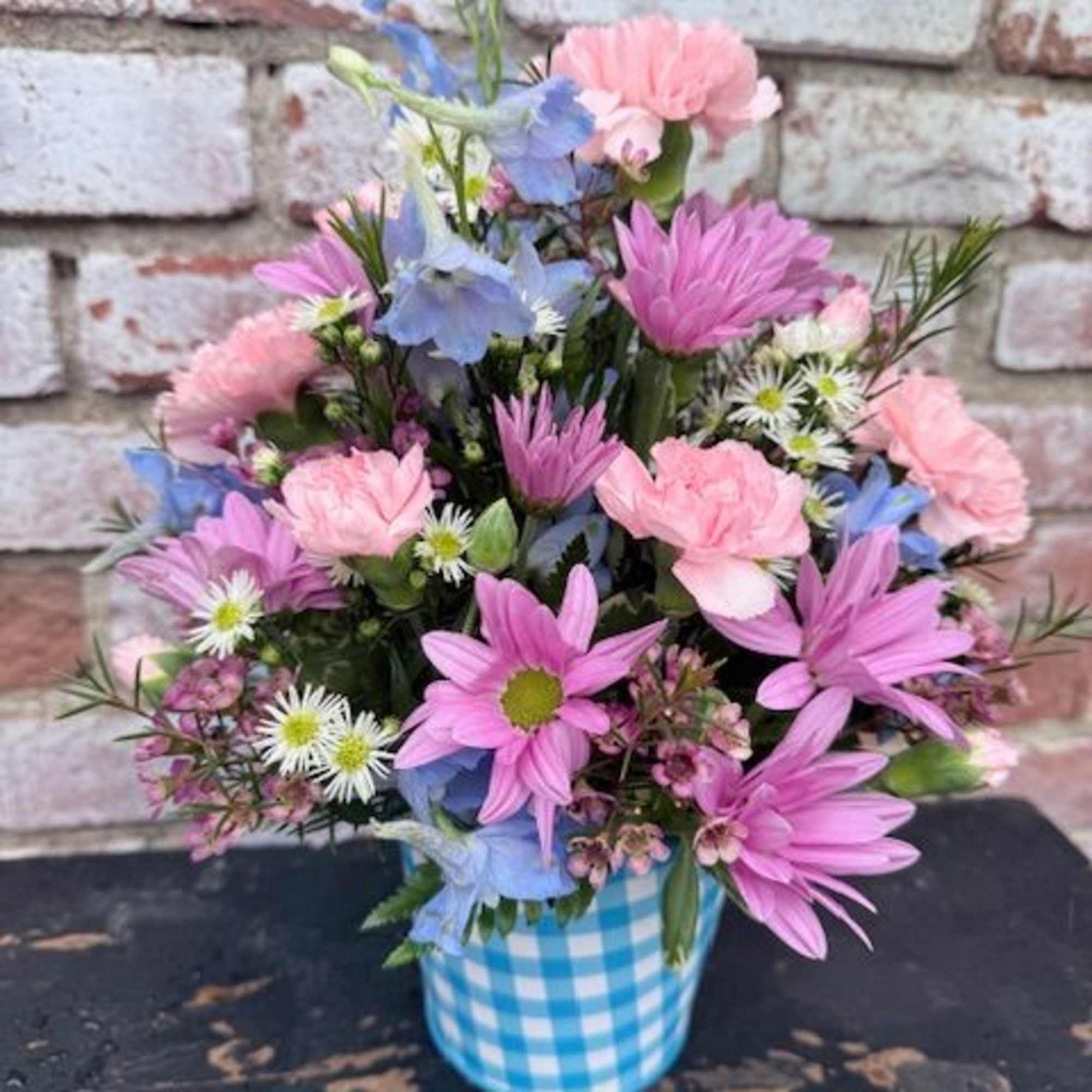 Soft, cheerful pastels make this Blooming Blue Happiness flower arrangement a bright