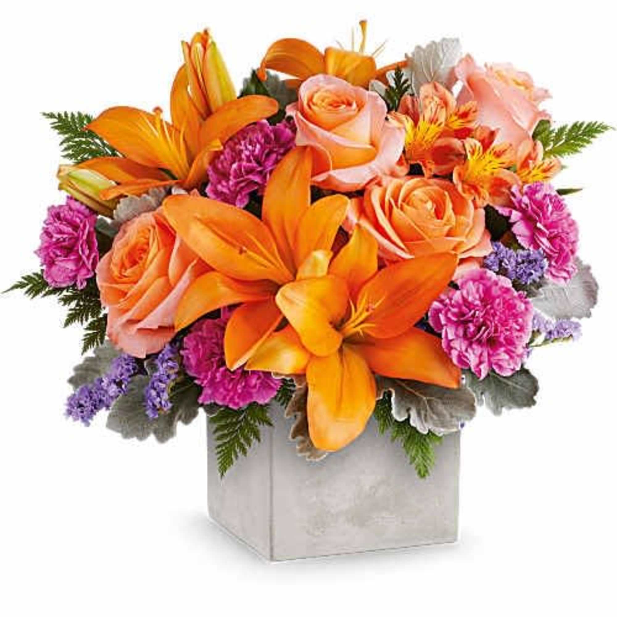 Bright orange lilies take center stage in this Garden Gem flower arrangement