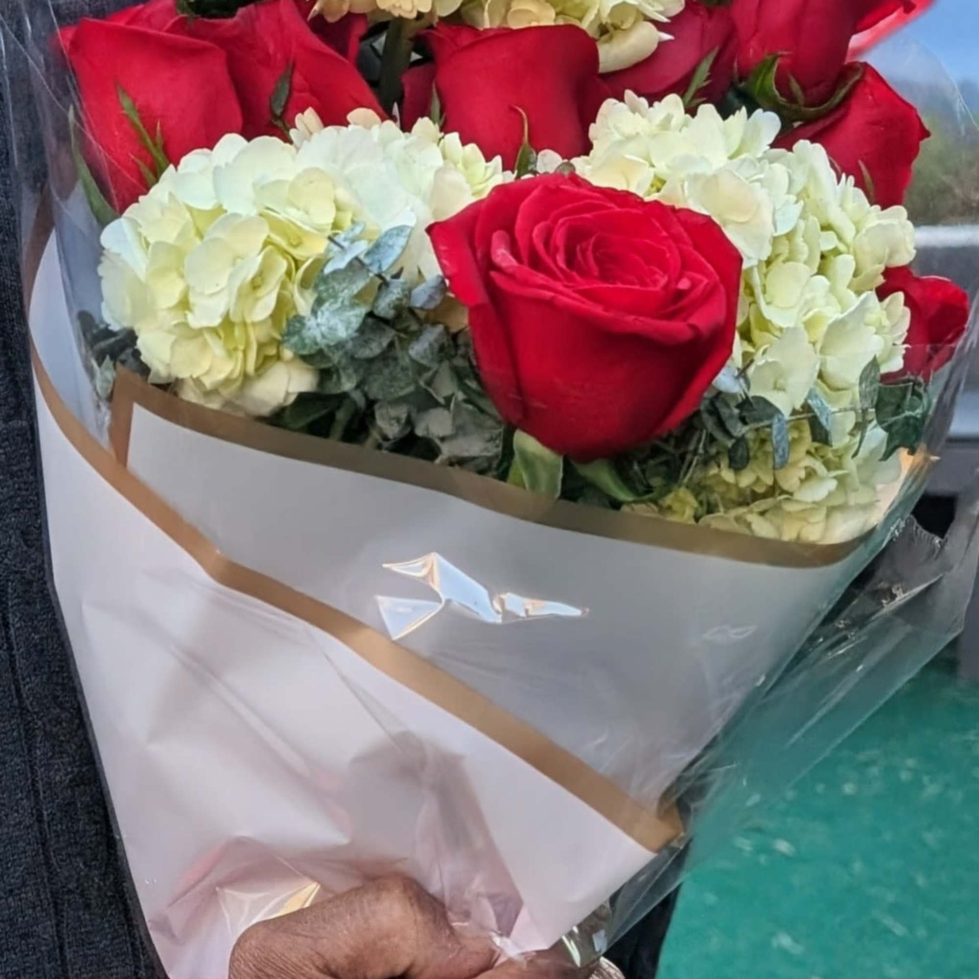 Fresh custom bouquet, tied and wrapped with a bow.  Designers Choice